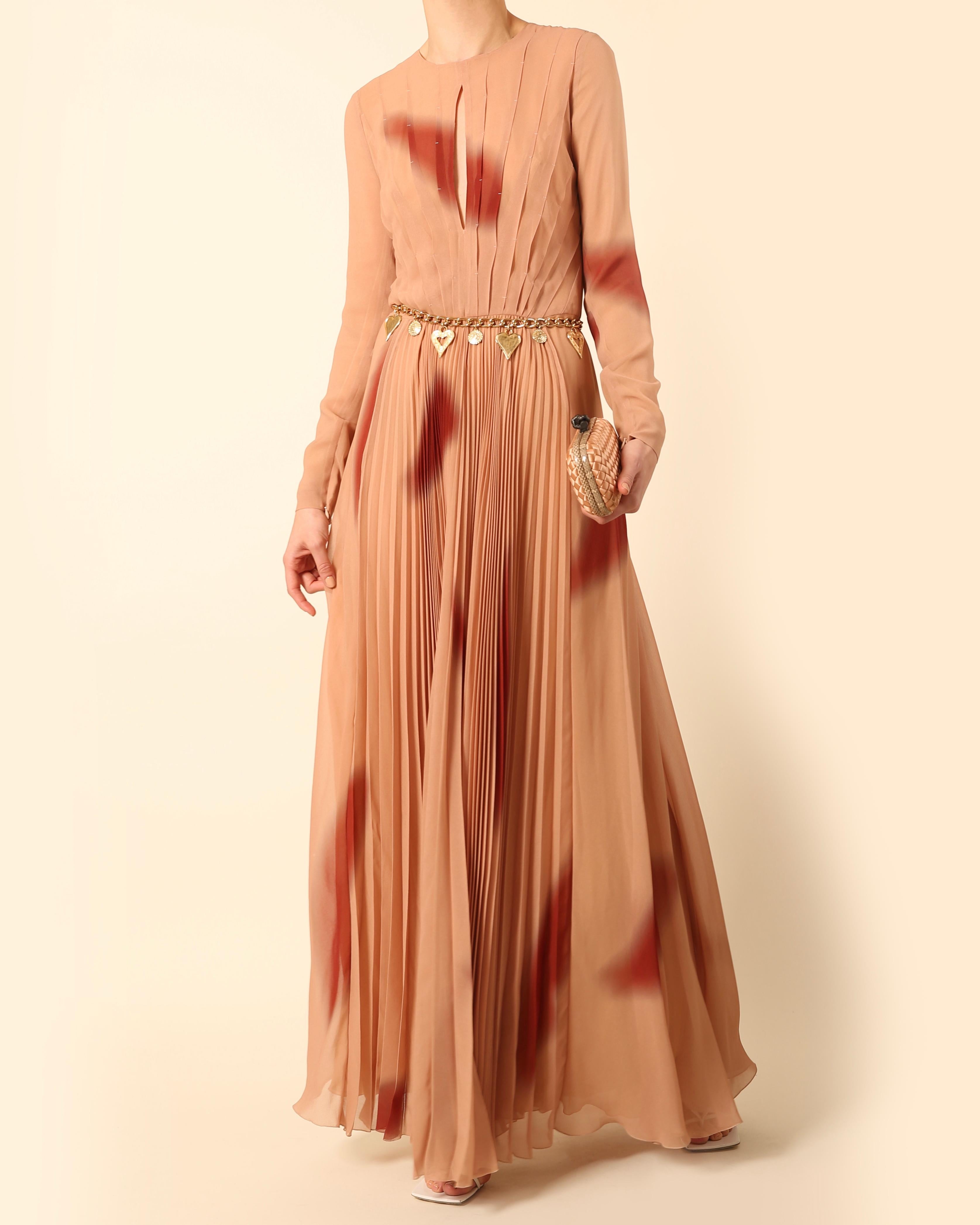 Sonia Rykiel full length gown in a beautiful shade of dusky pink with burgundy abstract print
Pleated upper with keyhole cut out neckline, long sleeves and crew neck
Plisse full double layered skirt
Cinched waist
Concealed zips to the