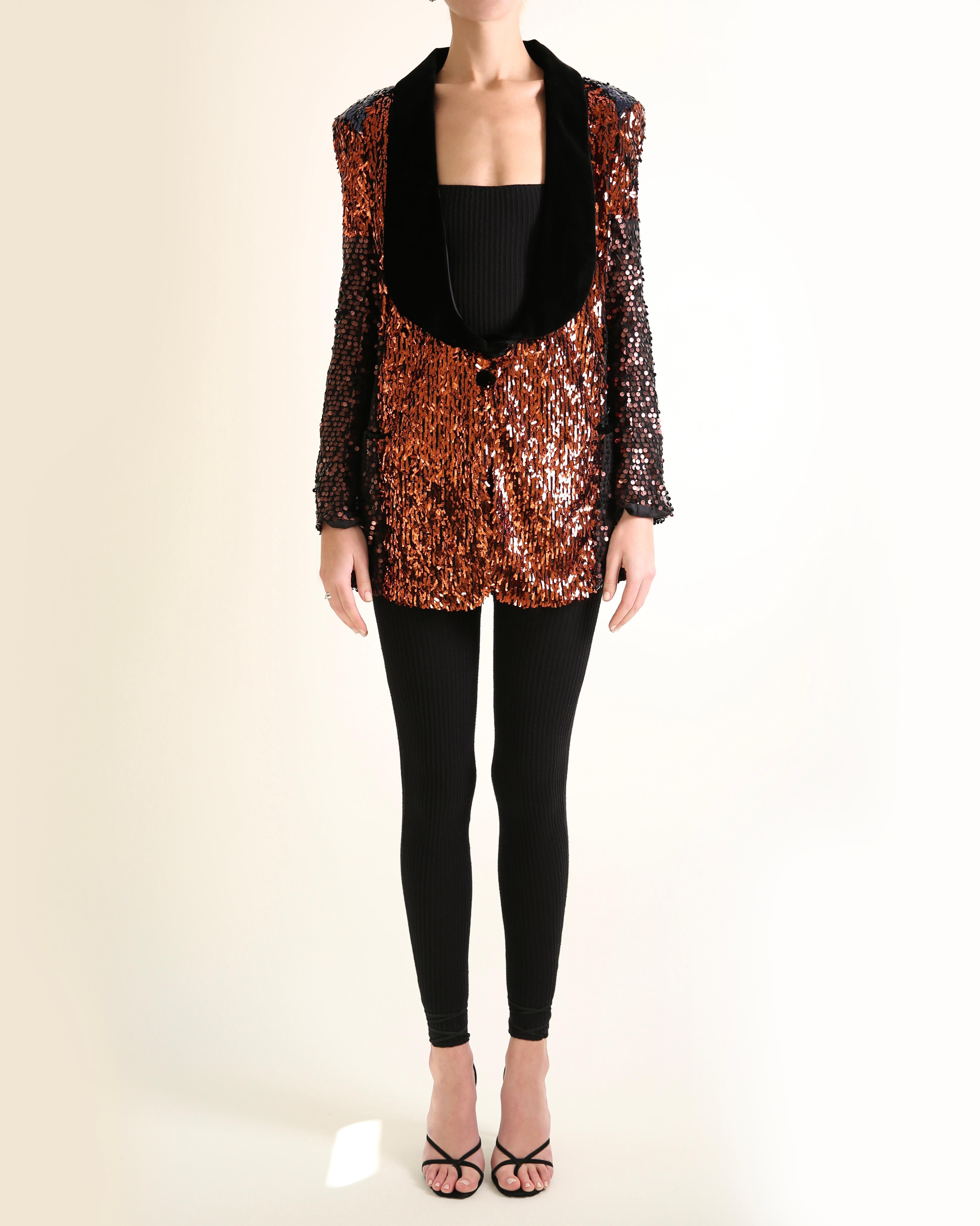 Sonia Rykiel Fall 2009 sequin blazer jacket
Oversized fit
Black mesh covered in color block panels of bronze and blue sequins
Black velvet collar and mock pockets 
Shoulder pads
Single button closure 

Composition:
100% Polyester

Size:
FR 36

In