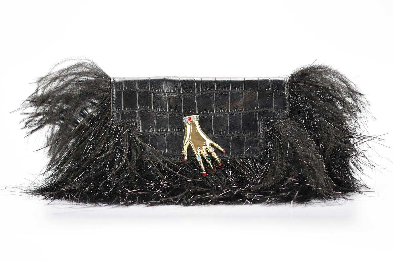 Sonia Rykiel Feather Trimmed Croc Effect Leather Clutch. Black. Magnetic fastening - Front. Comes with - detachable strap. Does not come with - dustbag or box. Height: 5.2 in. Width: 8.4 in. Depth: 1.2 in. Strap drop: 21 in. Condition: Used. Very