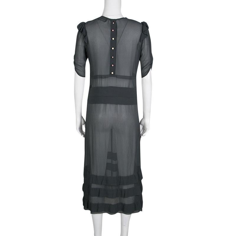 Consider the sheer midi dress from Sonia Rykiel a closet essential and investment. In 100 percent silk creation with a comfy and flattering silhouette, the dress is decorated with ruffle details for a feminine appeal. It dresses up with wedge heels