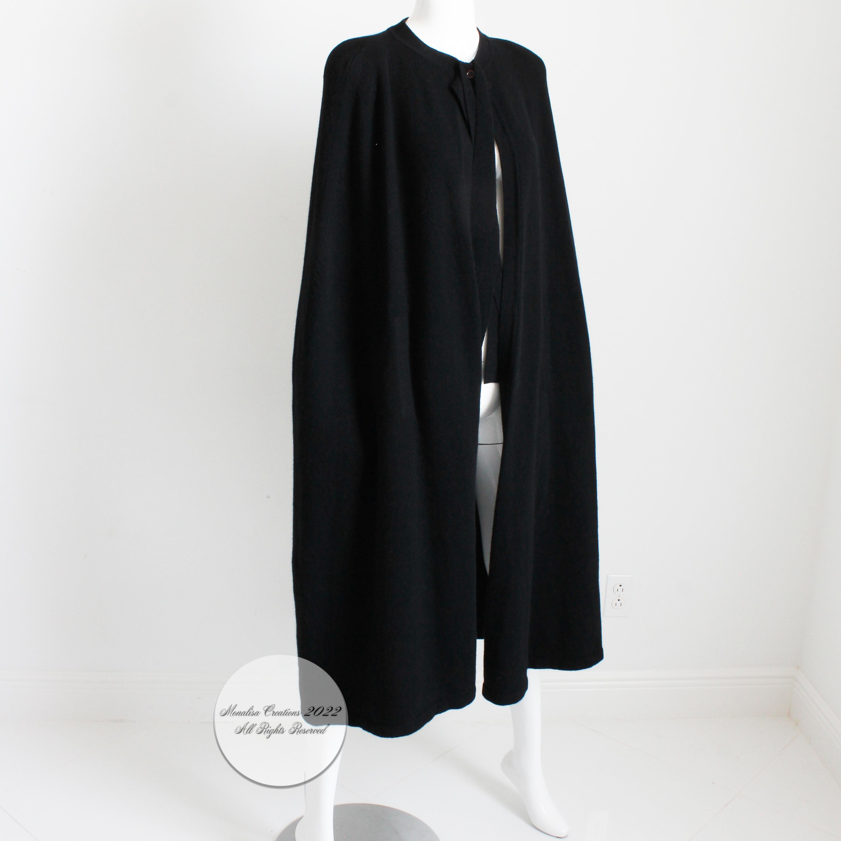 Fabulous Sonia Rykiel Angora Lambswool blend knit cape in black, likely made in the 90s.  Fastens with button at collar and knit wrap ties, and features small shoulder pads and arm holes.  So many ways to style and wear, it's definitely a wardrobe