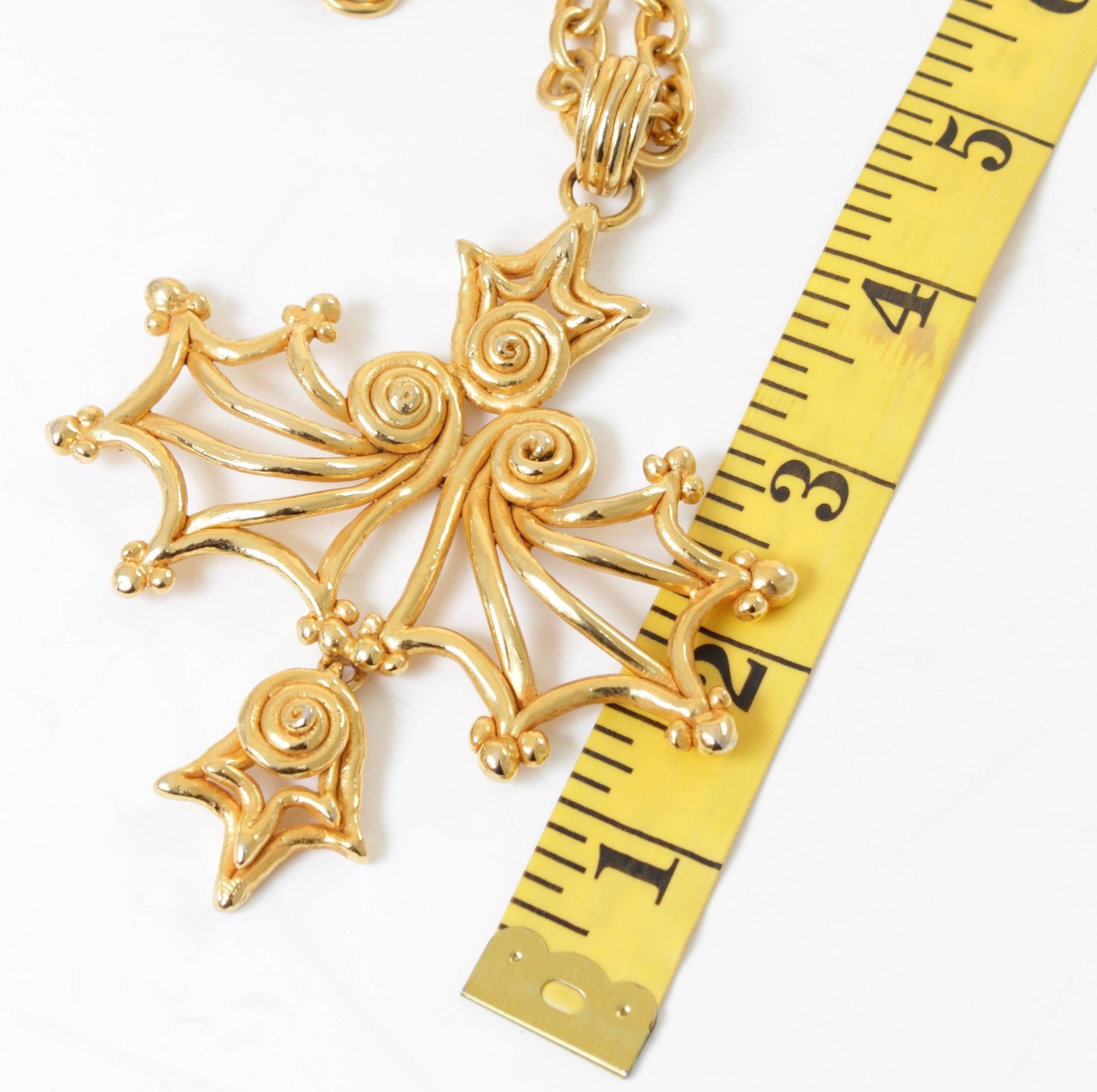 This massive abstract pendant and necklace was made by Sonia Rykiel Paris, most likely in the 1980s.  Made from gold metal, the pendant measures 4in H and the chain is adjustable for up to a 15in drop with a simple hook (total chain length is 30in).