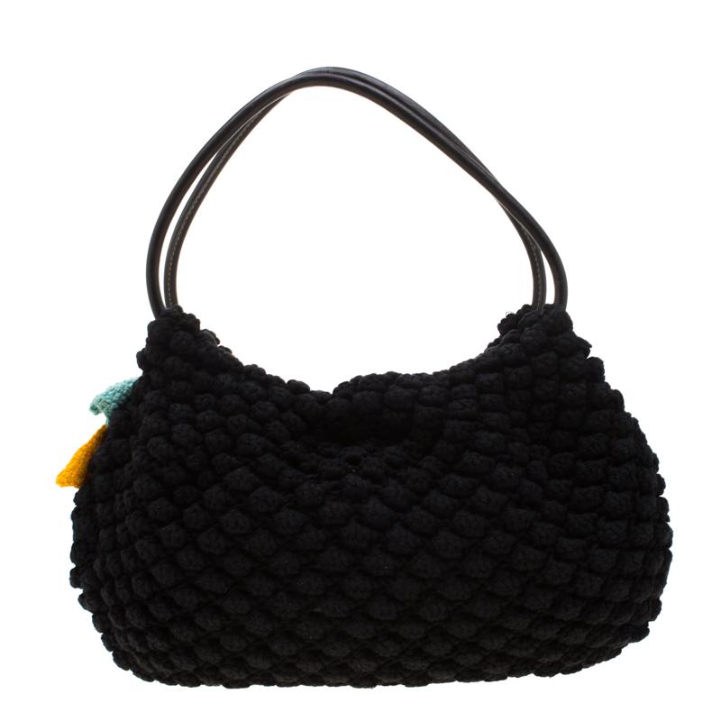 Visually pleasing and incredibly well-made is this simple Crochet hobo. It is held by two handles and equipped with a spacious interior. Detailed with a flower, this piece from Sonia Rykiel is just what you need.

