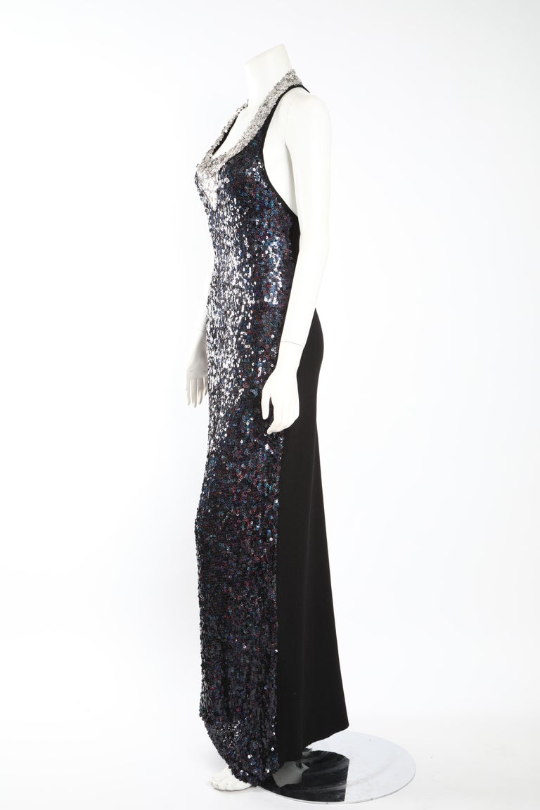 The simple silhouette of this floor-length gown by Sonia Rykiel is elevated by navy sequins and a silver sequin detail along the neckline. Size US 10. (Fits more like a 8) 