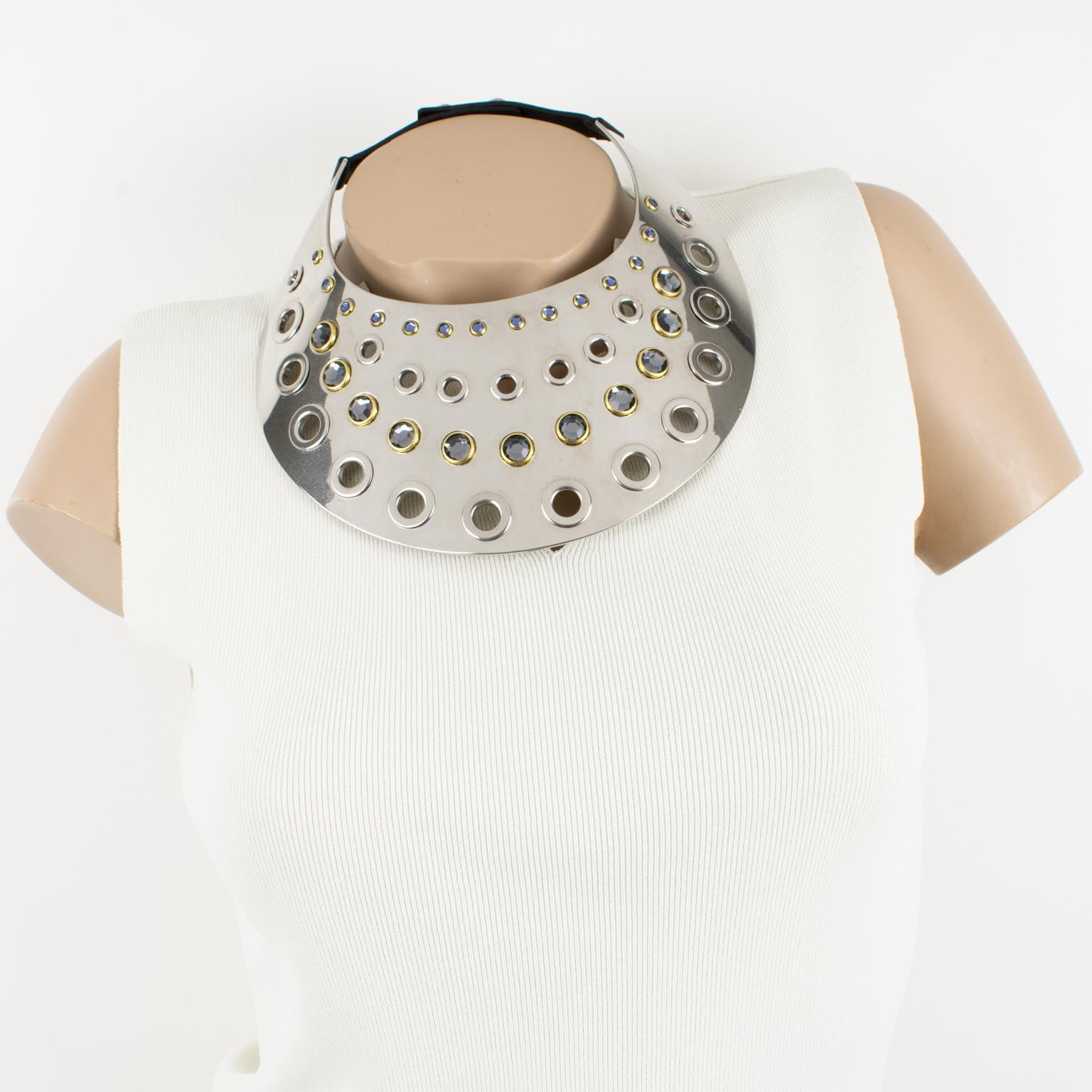 This spectacular Sonia Rykiel Paris sculptural futuristic choker necklace features a massive flat rigid bib shape in shiny chromed metal with see-thru carving and ornate with crystal rhinestones. The necklace has an adjustable leather closing link