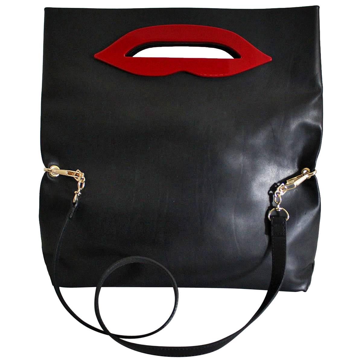 Beautifula and funny Sonia Rykiel kiss bag
Supersoft leather, nappa
Black color
Red lips
Can be carried by hand or on shoulder
Internal zip pocket
Cm 36 x 36 x 12  (14.1 x 14.1 x 4.72 inches, opened)
Worldwide express shipping included in the price !