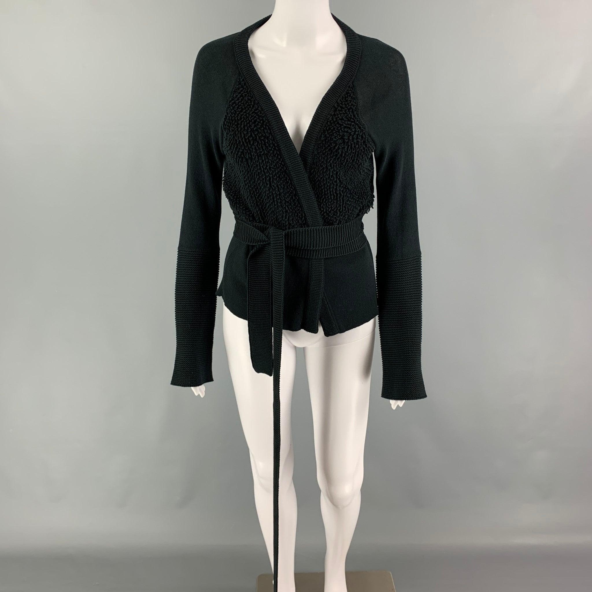 SONIA RYKIEL cardigan comes in a black cotton featuring textured panels, long sleeves, and a open front. Made in Italy.
Very Good
Pre-Owned Condition. 

Marked:   42 

Measurements: 
 
Shoulder: 16 inches Bust: 34 inches Sleeve: 25 inches Length: 21