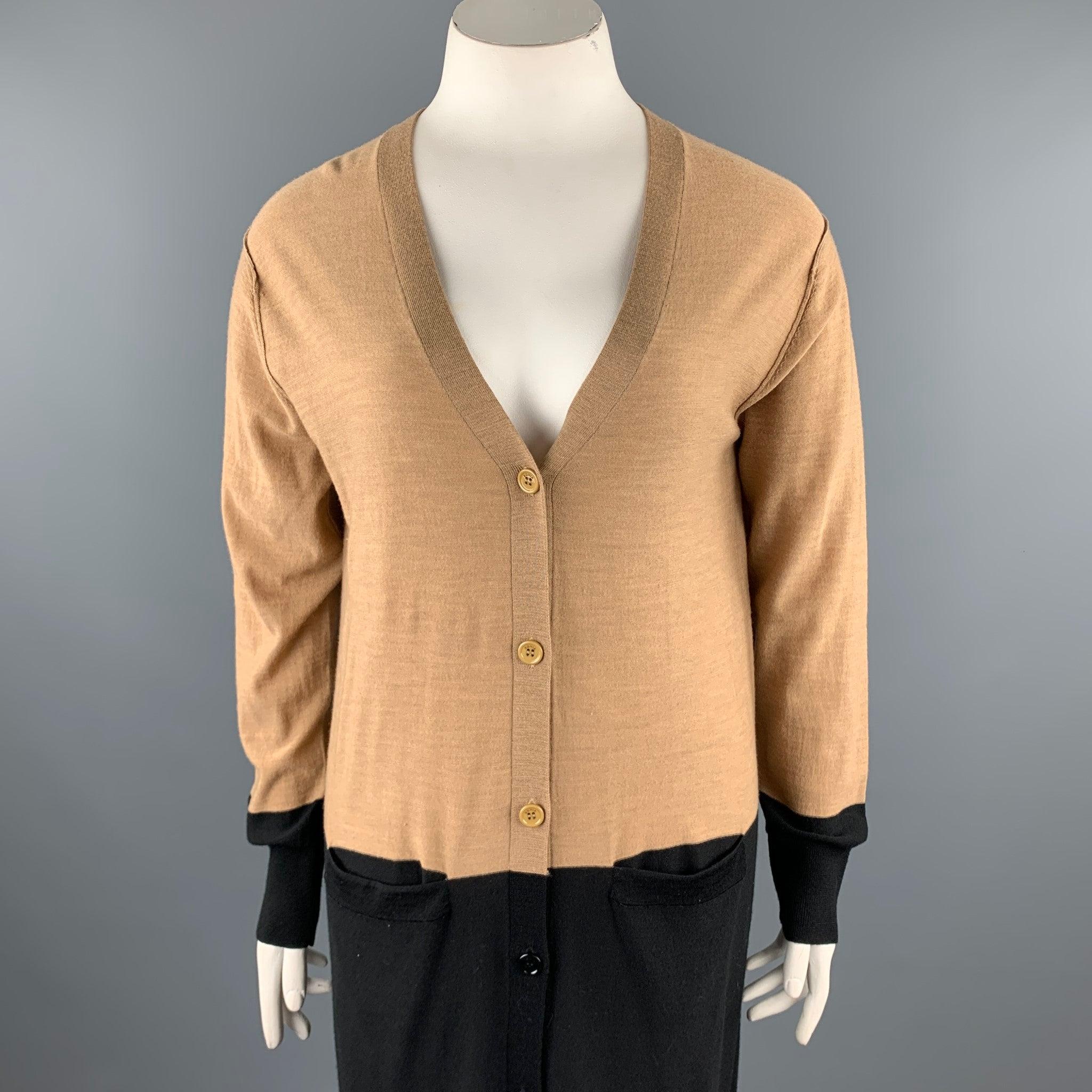 SONIA RYKIEL cardigan comes in a black & beige knitted color block wool featuring front pockets and a buttoned closure.Very Good
Pre-Owned Condition. 

Marked:   L 

Measurements: 
 
Shoulder: 19 inches 
Bust: 42 inches 
Sleeve: 25 inches 
Length: