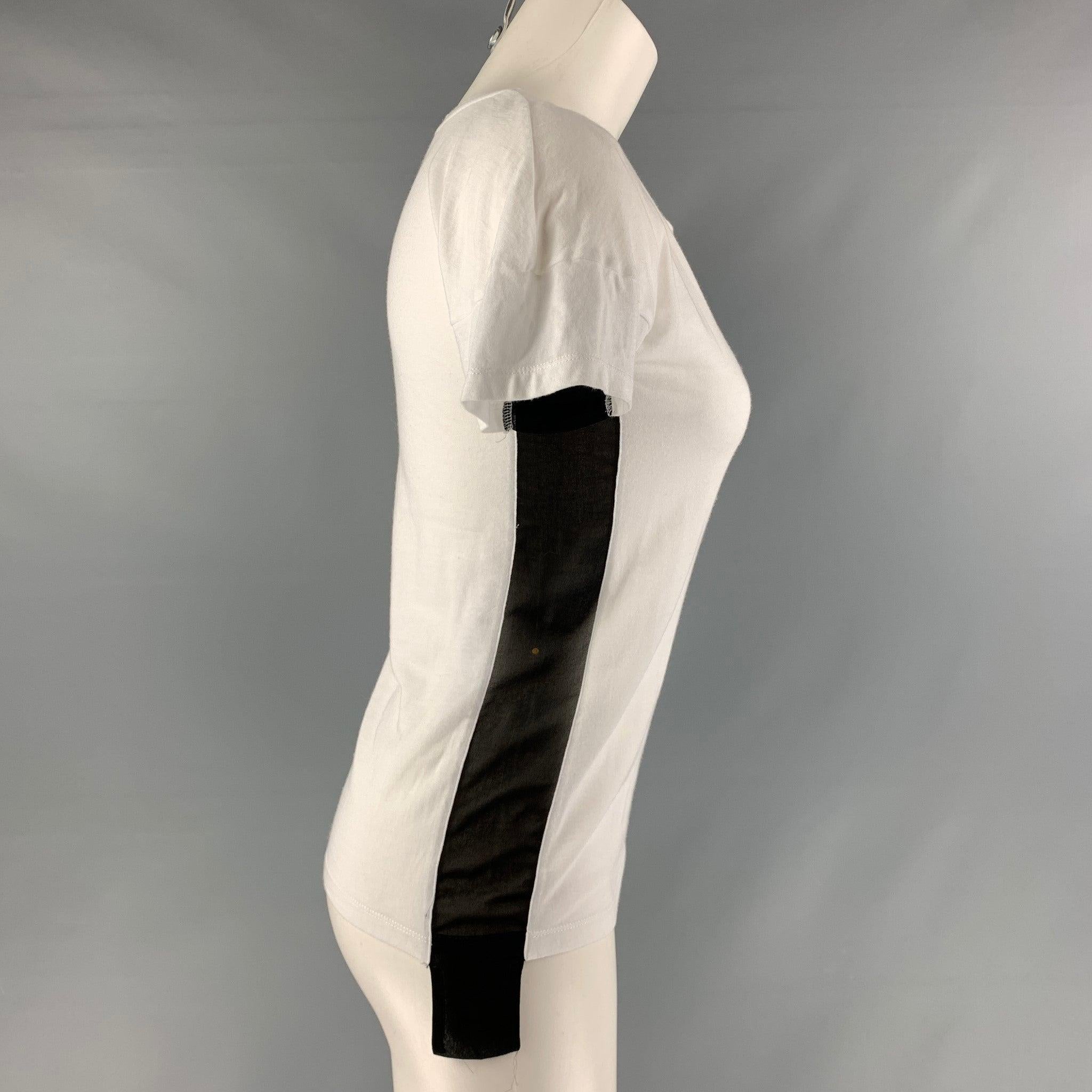 SONIA RYKIEL T-shirt comes in a white cotton featuring a crew neck and black panels on sides. Excellent
 Pre-Owned Condition. Fabric tag removed. 

Marked:   No size marked.  

Measurements: 
 
Shoulder: 17 inches Bust: 30 inches Sleeve: 3 inches