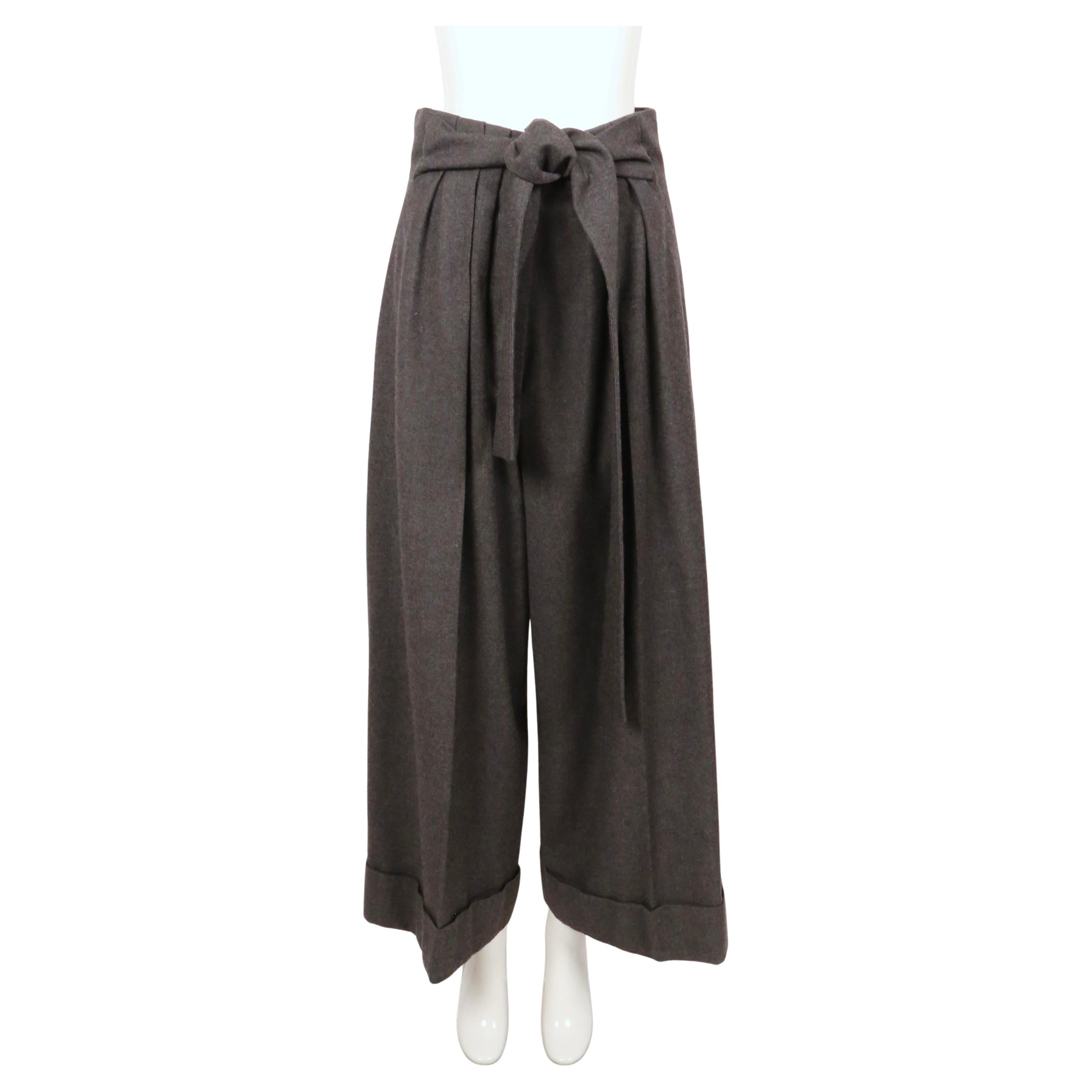 Charcoal grey wool pants with ultra high waist and matching half belt from Sonia Rykiel dating to the early 2000's. Belt can be worn in front or back. French size 40. Approximate measurements: rise at front 16.5