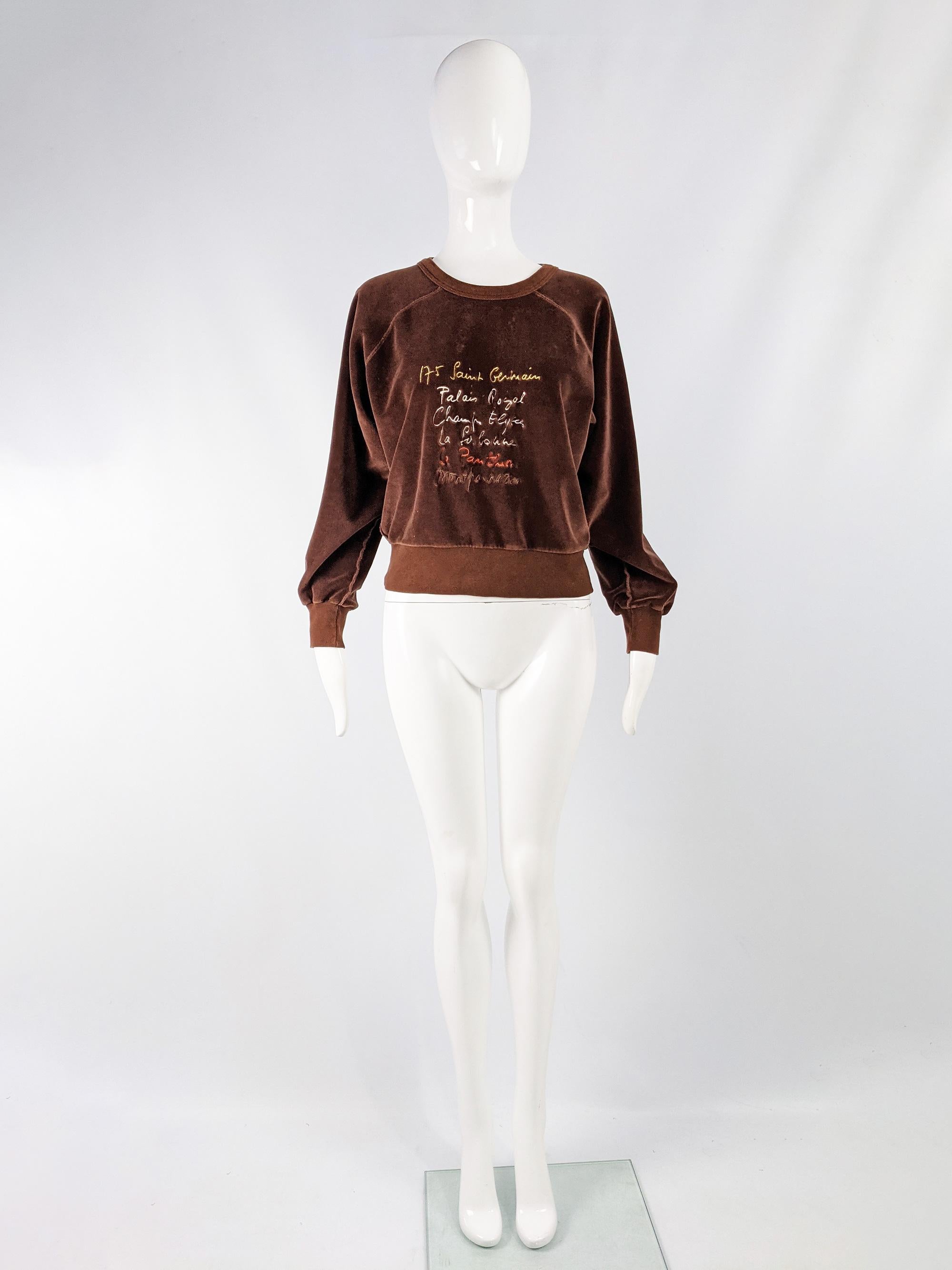 A chic vintage womens sweatshirt from the 80s by luxury French fashion designer, Sonia Rykiel. In a brown velour / stretch velvet with long sleeves and embroidery on the front. 

Size: Not indicated; fits like a modern women’s Large or looks great