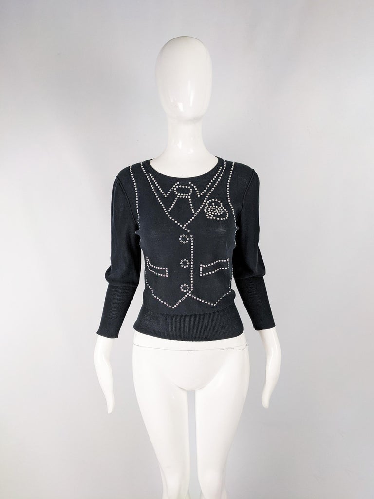 A cute vintage womens jumper from the 80s by luxury French fashion designer, Sonia Rykiel. In a black knit fabric with an amazing rhinestone pattern creating a trompe l'oeil effect of a waistcoat and shirt. It has long ribbed cuffs and a long ribbed