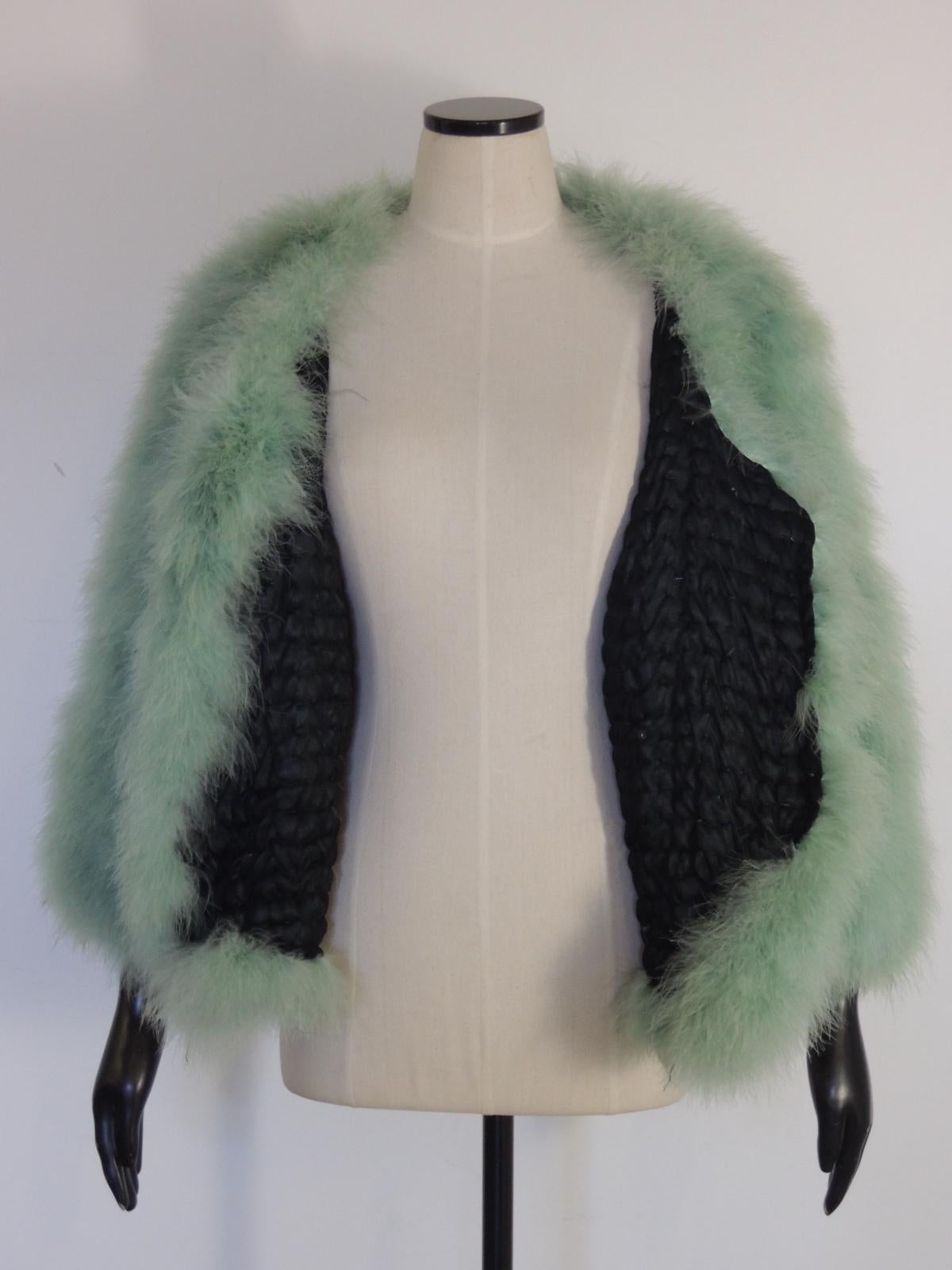 green feather coat