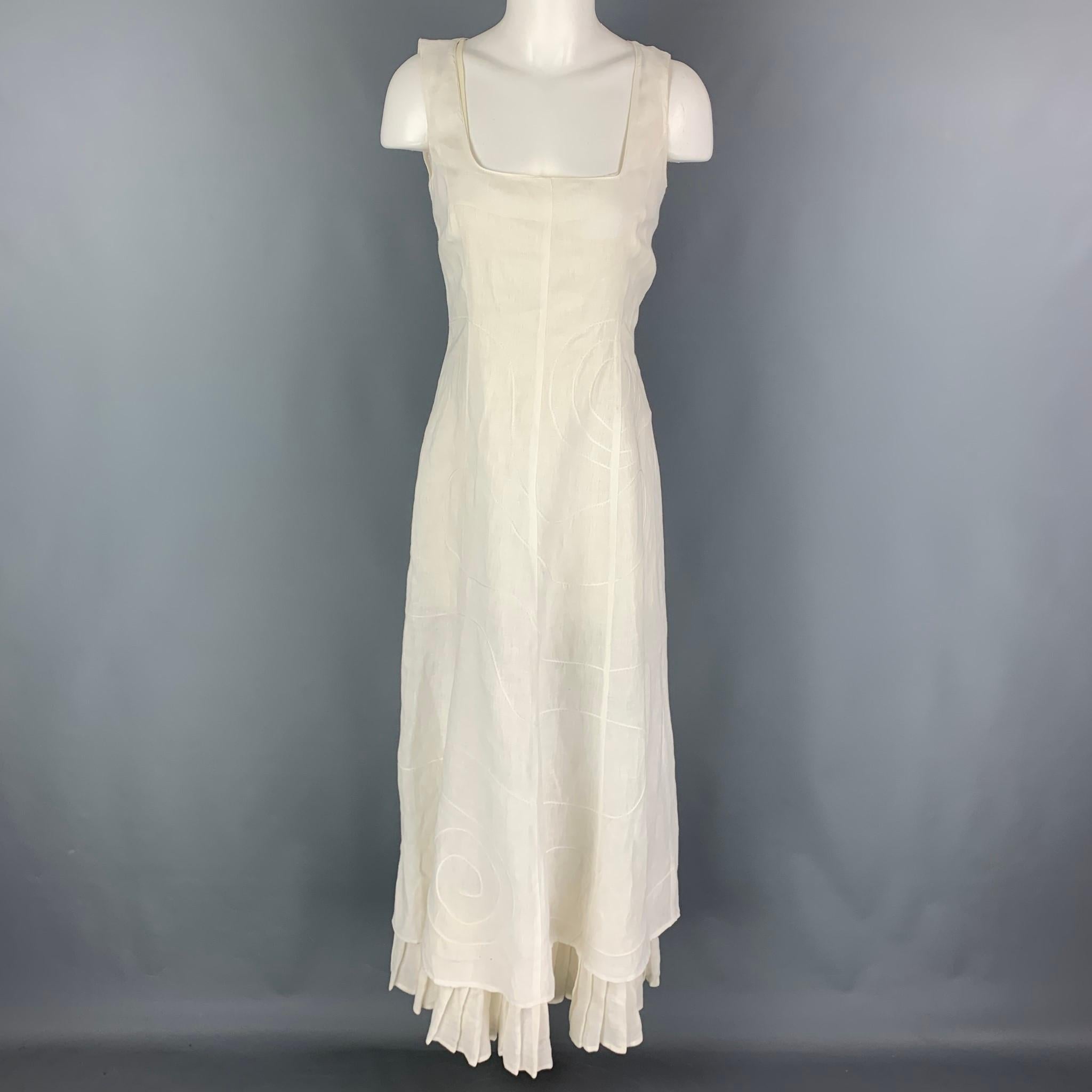 SONIA SPECIALE dress comes in a white material with a removable liner featuring embroidered designs, ruffled, sleeveless, and a back zipper closure. Made in Italy. 

Good Pre-Owned Condition. Light marks. As-is.
Marked: 44

Measurements:

Bust: 34