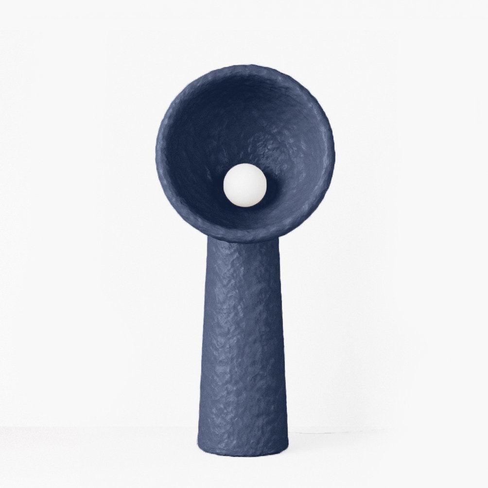 SONIAH / Ukrainian for sunflower / a symbol of prolific Ukrainian earth.

Each floor lamp is crafted by hand in FAINA’s sustainable material — ZTISTA. Sculptural SONIAH lamps stem from the ground, their pure shapes eliminate the excess and shine
