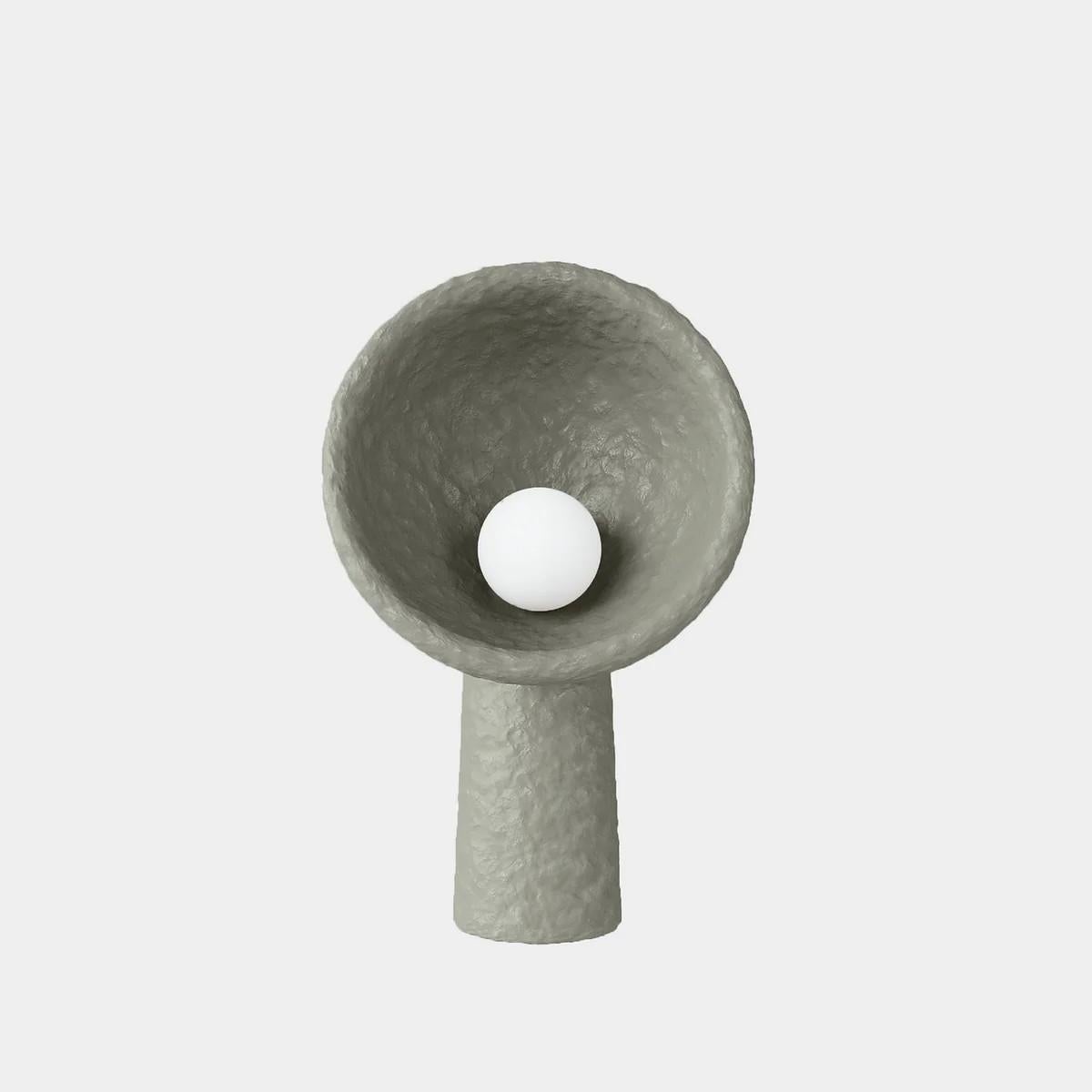 SONIAH / Ukrainian for sunflower / a symbol of prolific Ukrainian earth.

Each floor lamp is crafted by hand in FAINA’s sustainable material — ZTISTA. Sculptural SONIAH lamps stem from the ground, their pure shapes eliminate the excess and shine