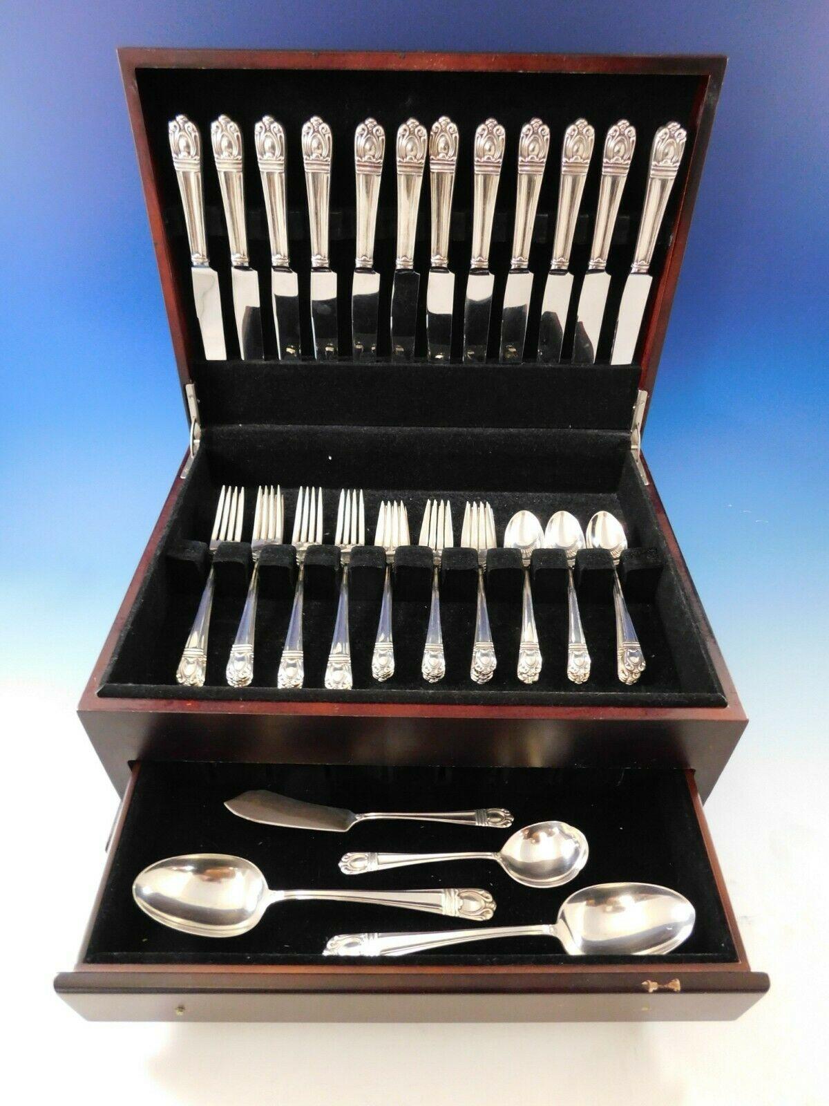 Exquisite Sonja by International, circa 1937, sterling silver flatware set with modern design, 52 pieces. This set includes:

 12 knives, 9 1/8