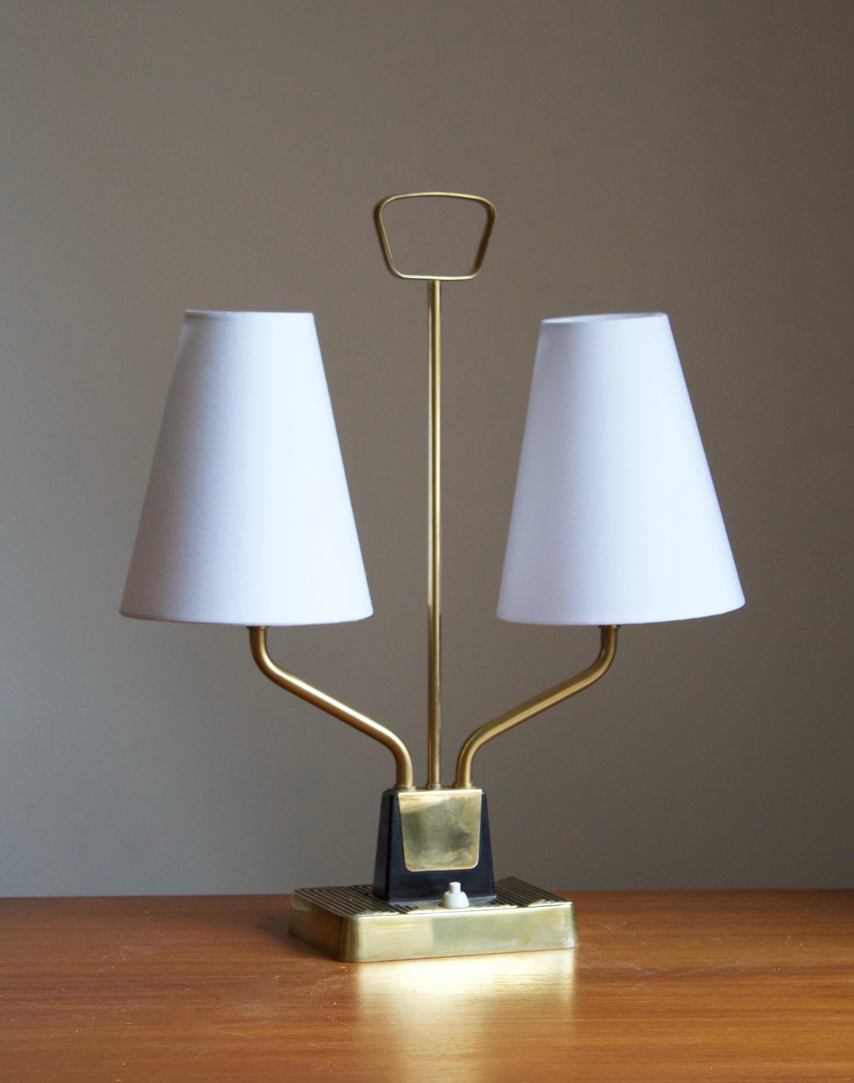 A table lamp / desk light. Designed by Swedish sculptor Sonja Katzin, (1919-2014). Produced by ASEA, Sweden, 1950s. Stamped.

Stated dimensions include lampshades.
