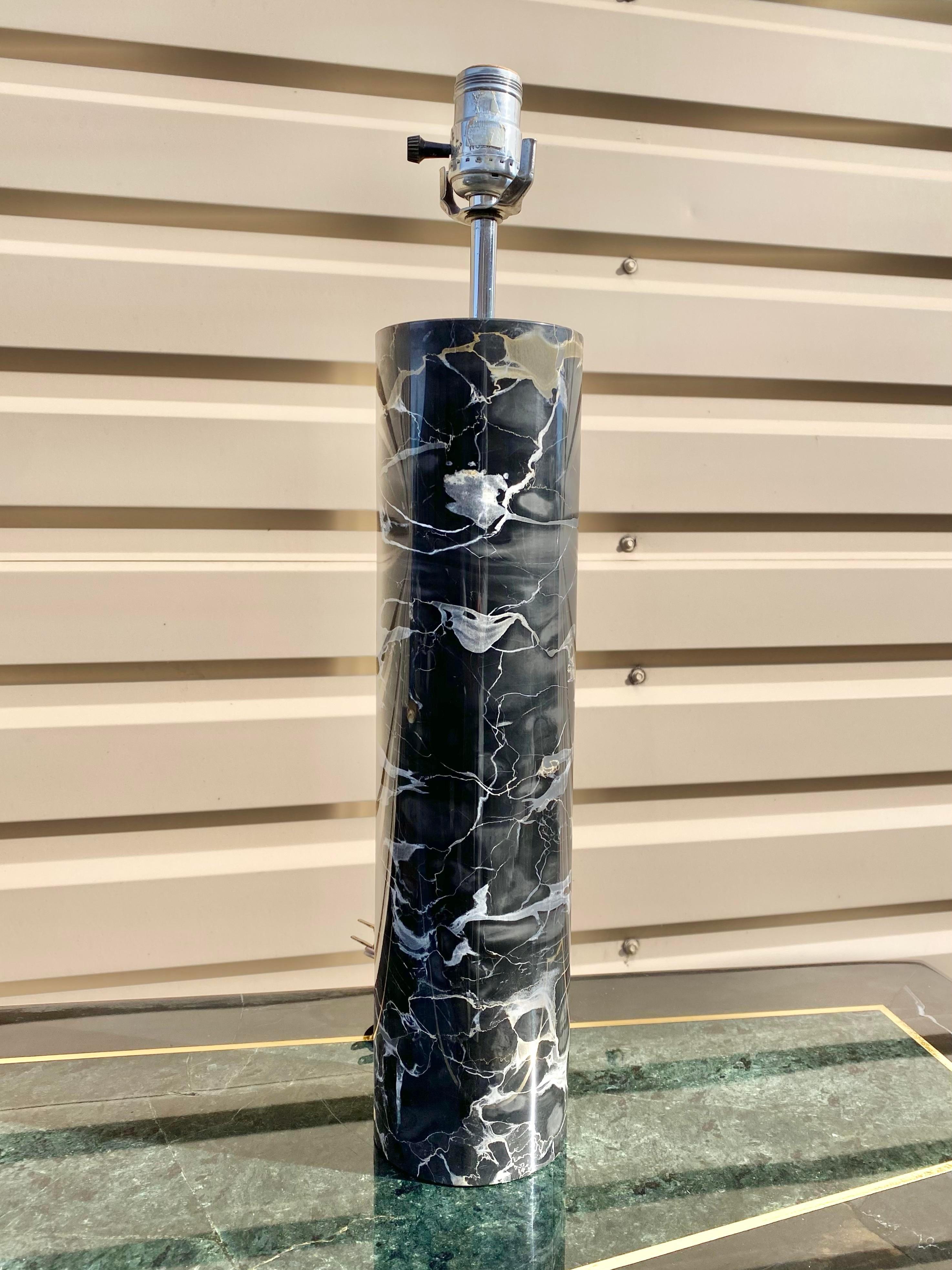 Italian Portoro marble Minimalist cylindrical table lamp. This is one of the heaviest lamps for its size we have ever had the pleasure of offering. A true geometric purist marvel in a beautiful carved stone mass. We have paired this lamp with an