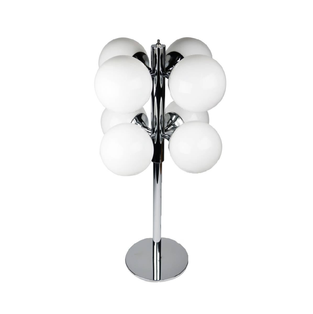 A striking chrome Robert Sonneman 1970s table lamp with eight frosted glass globes on chrome cylinders connected to a center chrome rod. New bulbs and power switch. In excellent vintage condition. 

Measure: 14.5” x 14.5” x 26.5”.