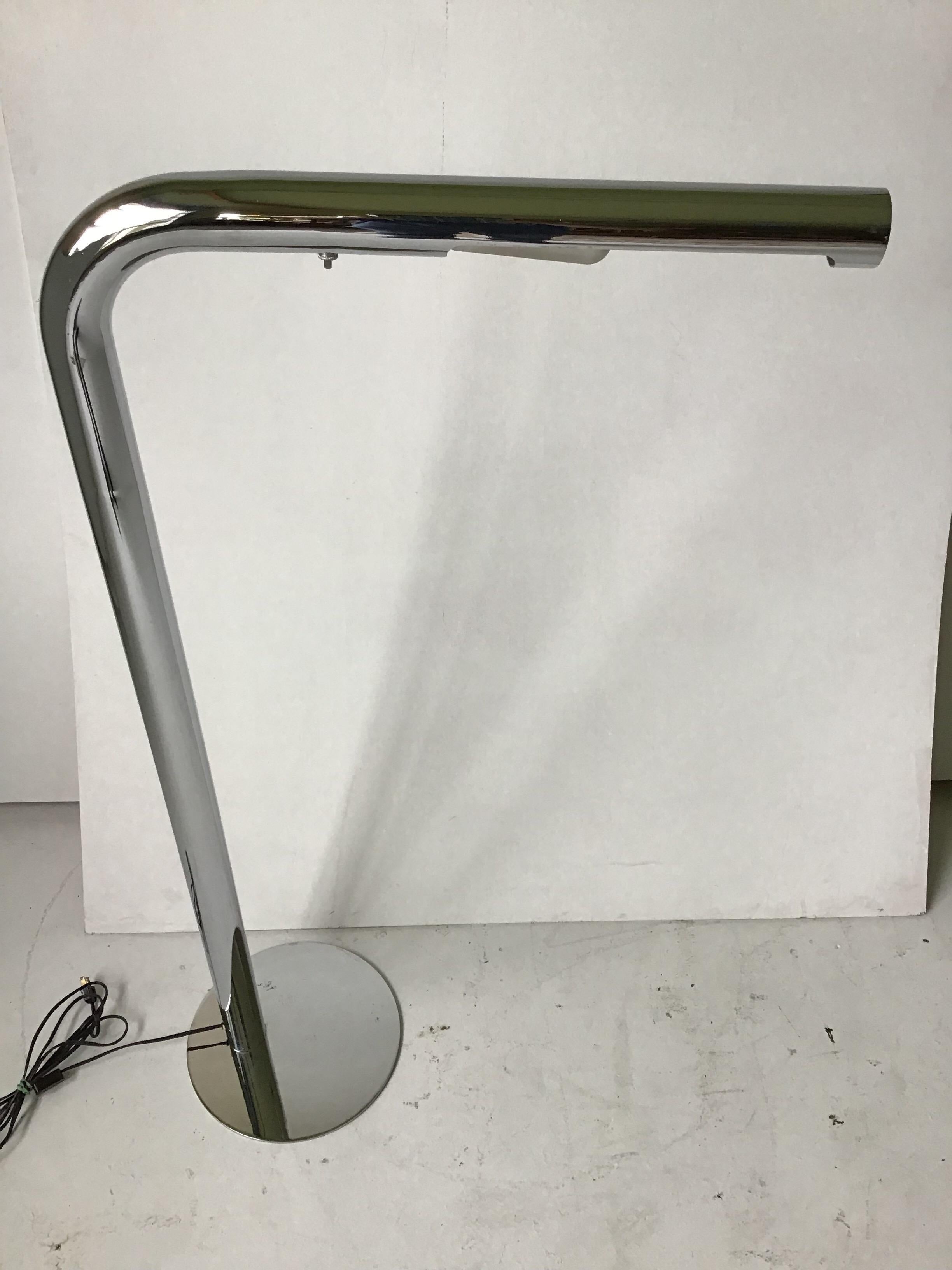 Signed Sonneman. Incredible, simplistic form! It is a chrome tube, bent with horizontal lamp housing. 1970s space age.