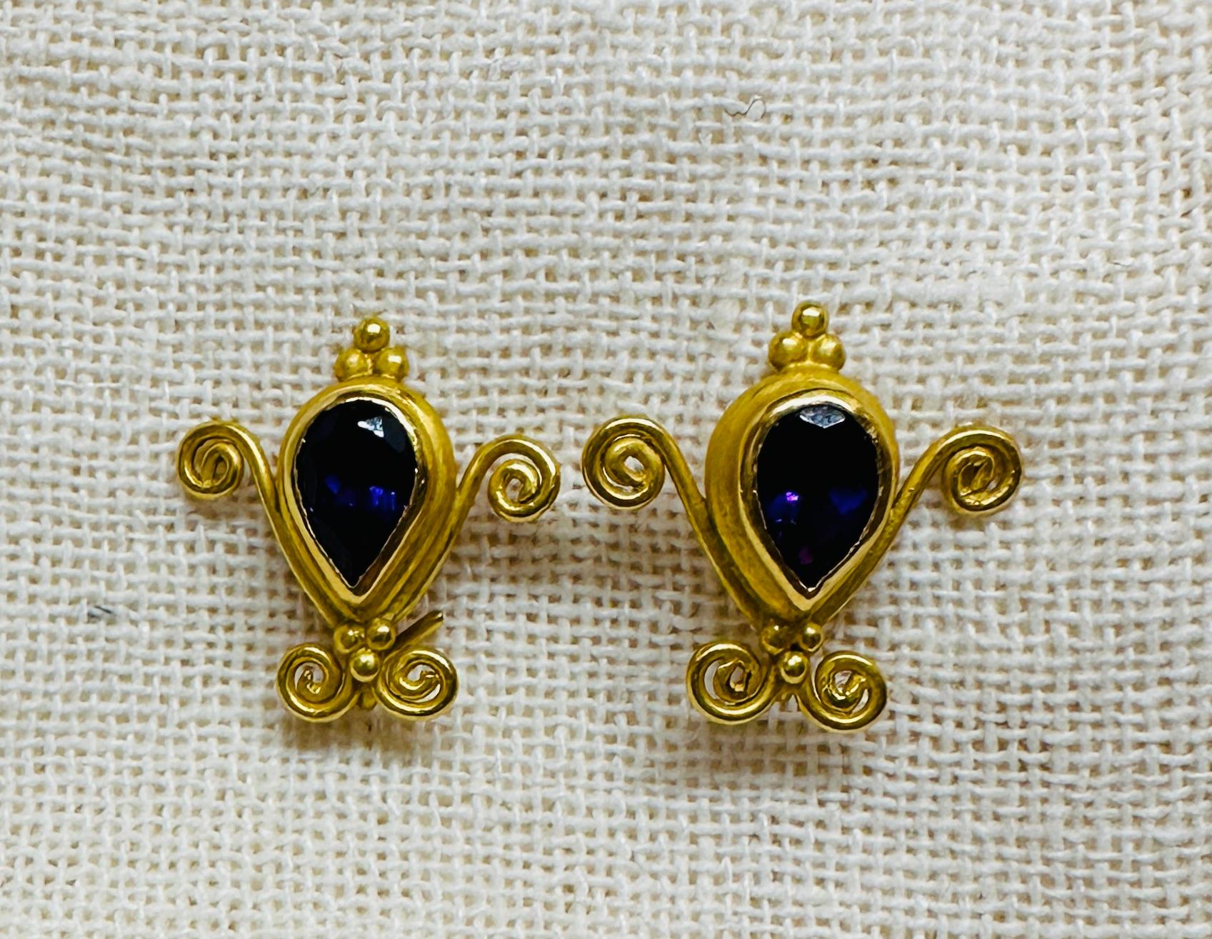 Spectacular earrings by Carolyn Tyler inspired by a Colonial Spanish design.

Hand made using both 22K and 18K recycled yellow gold, these earrings feature faceted briolette, pear shape and round cut amethysts. Adding to their versatility, the