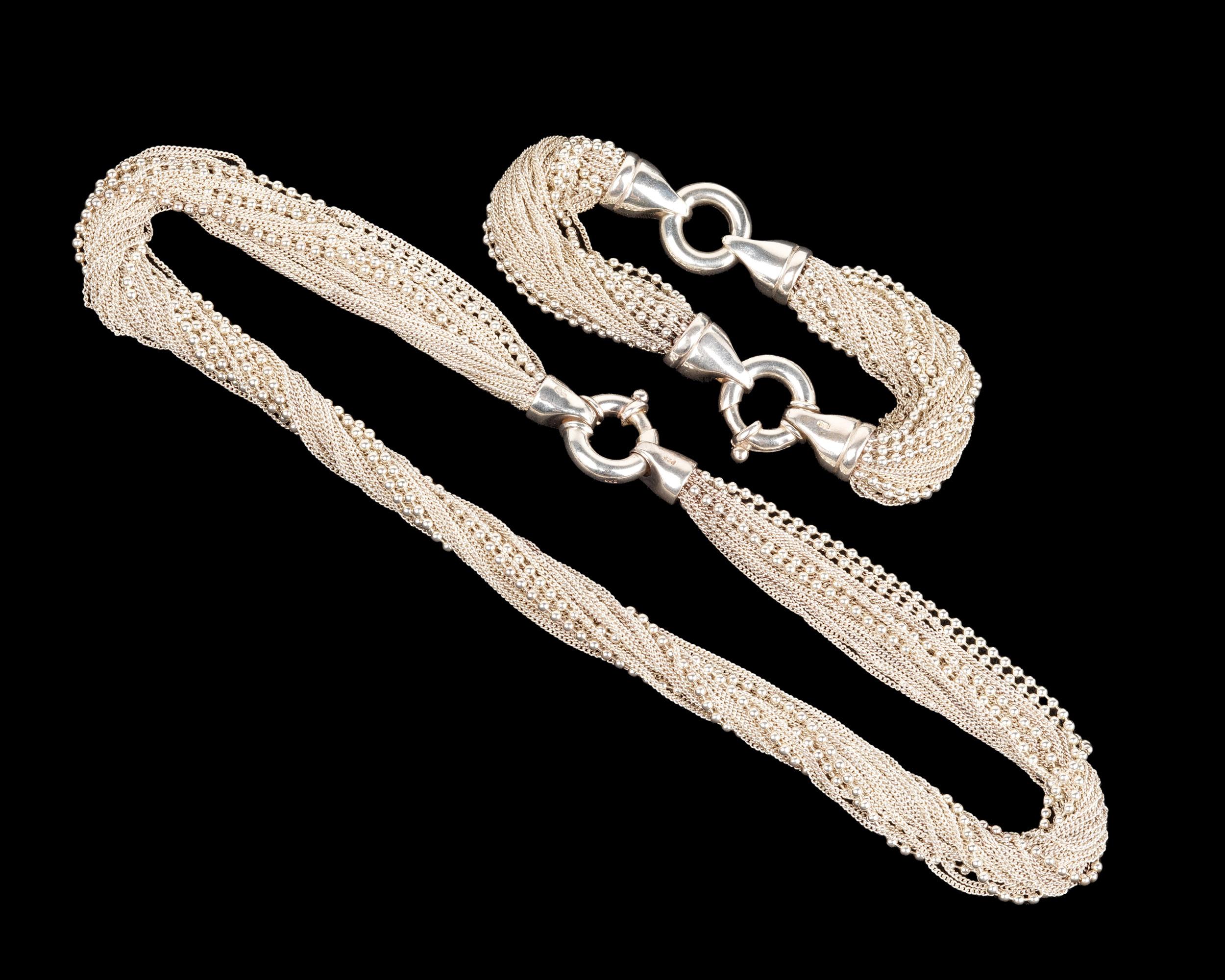 Sonya Ooten multi strand twisted white bead and mesh necklace and bracelet set. Bracelet is 7.5 inches long and may also be used as an extender for the necklace. Each is marked with Ooten cipher and 925. Approximately 3.1 troy ounces. 