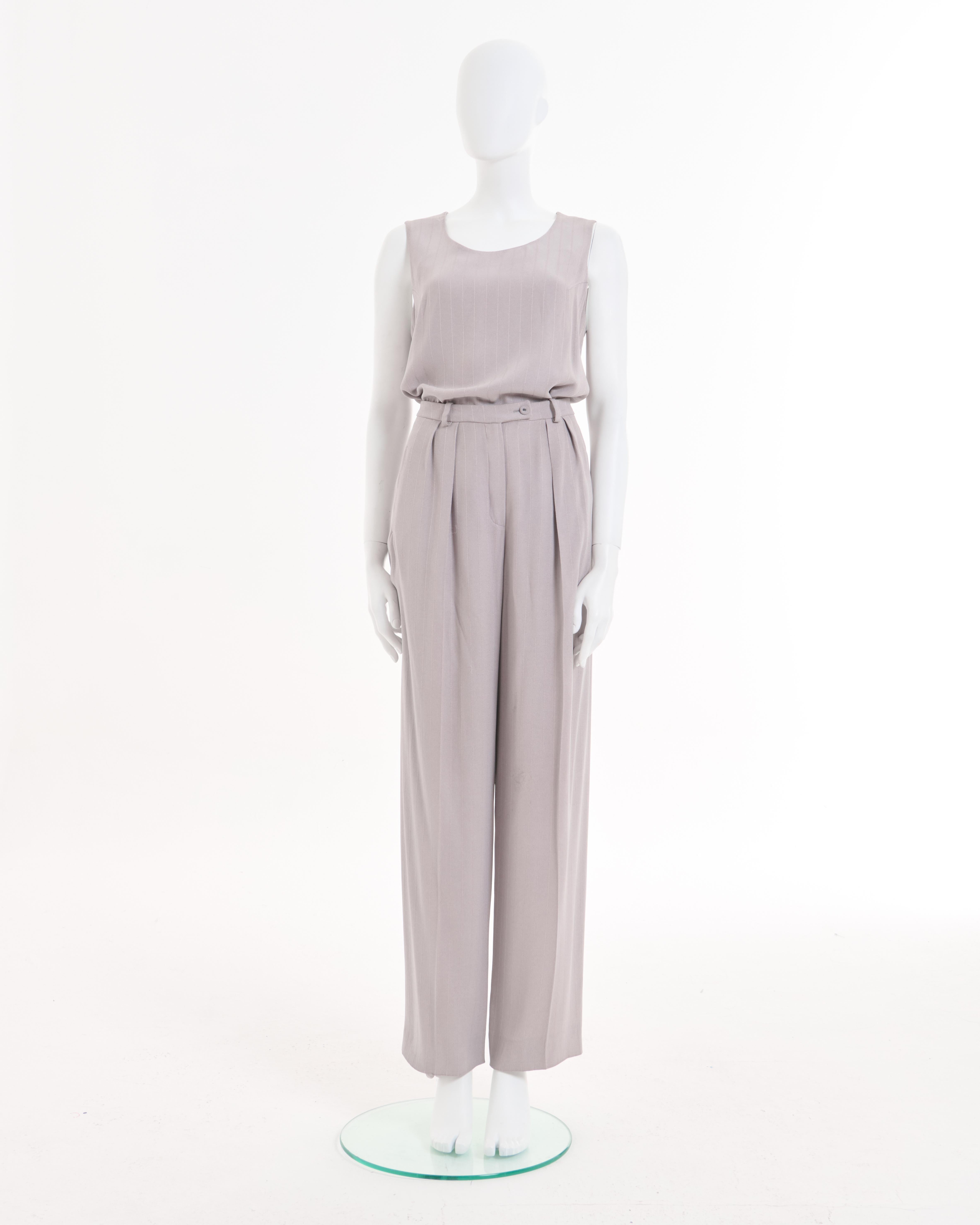 - Designed by Sonya Rykiel
- Sold by Skof.Archive
- Grey Viscose Set
- Long Trench Coat
- Button closure
- Two big pockets
- Grey Top with round neck line
- Sleeveless
- High waist grey pants
- Loose Fit
- Excellent Condition
- Made in France
-