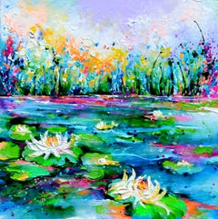 Lilies roses et blanches sur l'étang