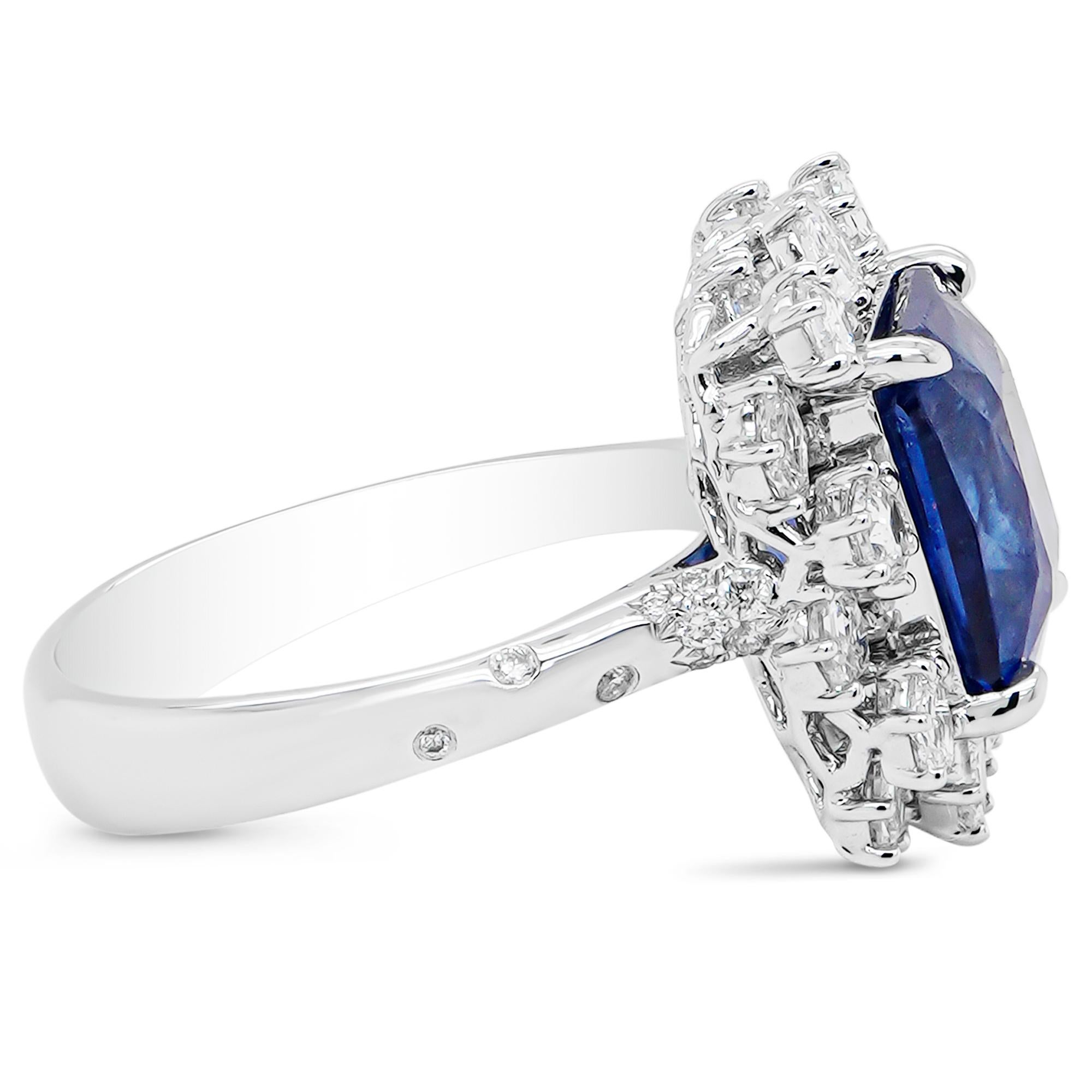 This beautiful 6.00 carat vivid blue sapphire is set along with 1.31 carat rare hexagon shape diamond and 0.08 carats of white round diamond. The diamond details are mentioned below:

Color: F
Clarity: Vs

Sapphire is one of the Big three of jewelry
