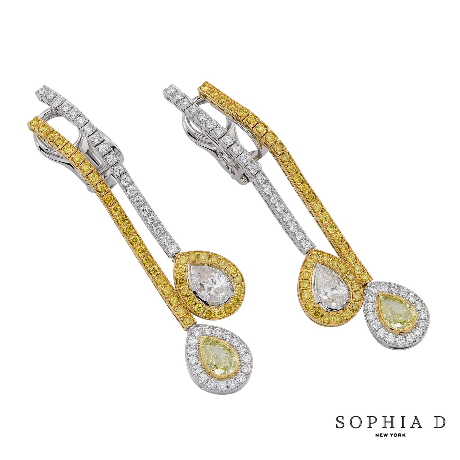 An exquisite display of artistry and elegance, these Sophia D drop earrings feature a striking combination of white and fancy yellow diamonds, set in a refined 18K yellow gold and platinum design. The earrings are highlighted by two pear-shaped