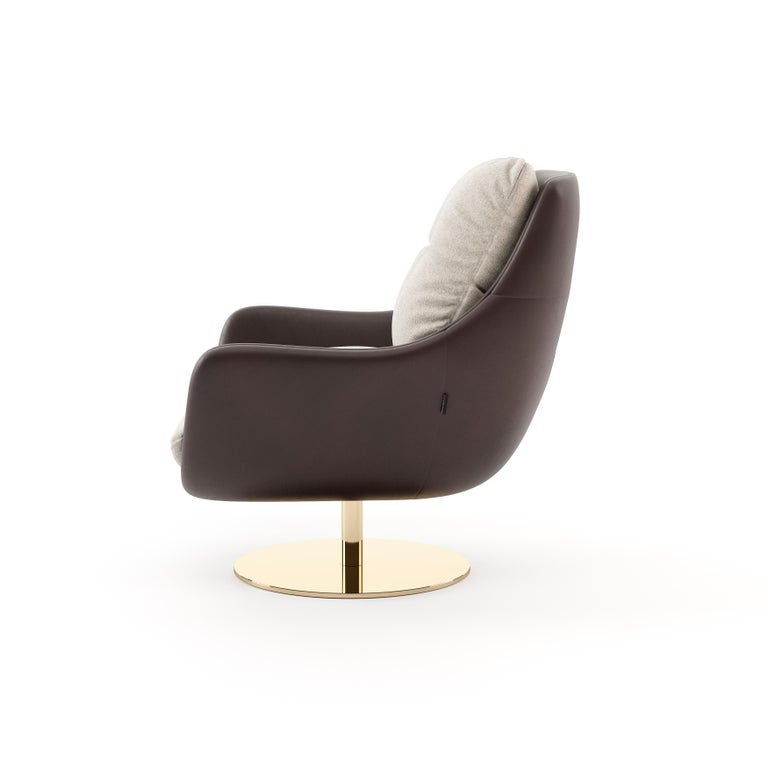 Sophia armchair is also a lounge chair with a curvy and shimmering ottoman. Practical and comfortable, this seating piece features a gold metallic base that can swivel 360 degrees and a fully upholstered body in classy velvet. Sophia is an easy way