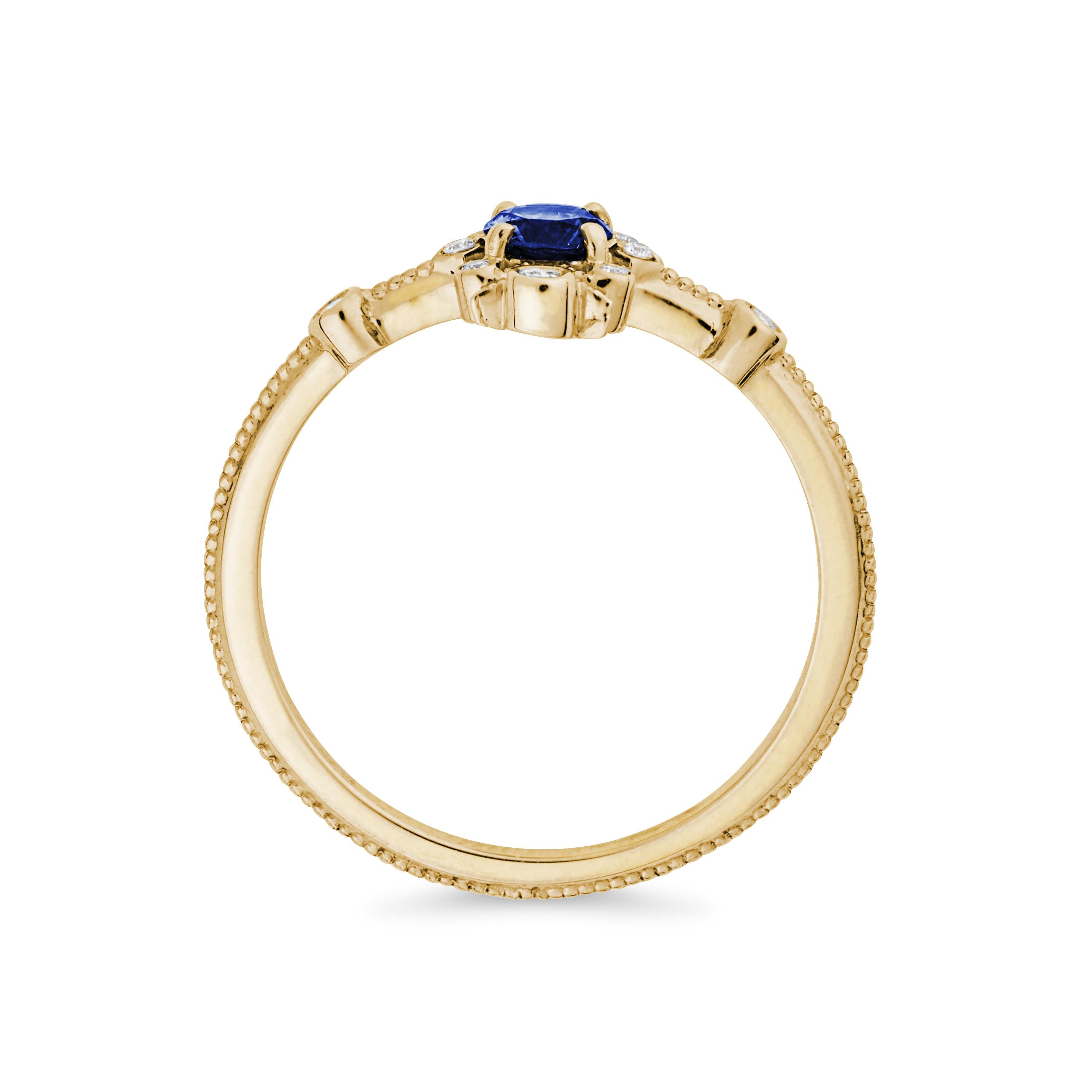 This 14K yellow gold band features a fair trade blue sapphire with accent diamonds.

Materials + Dimensions: 14k yellow gold, 4mm blue sapphire center stone, .03 ctw diamonds