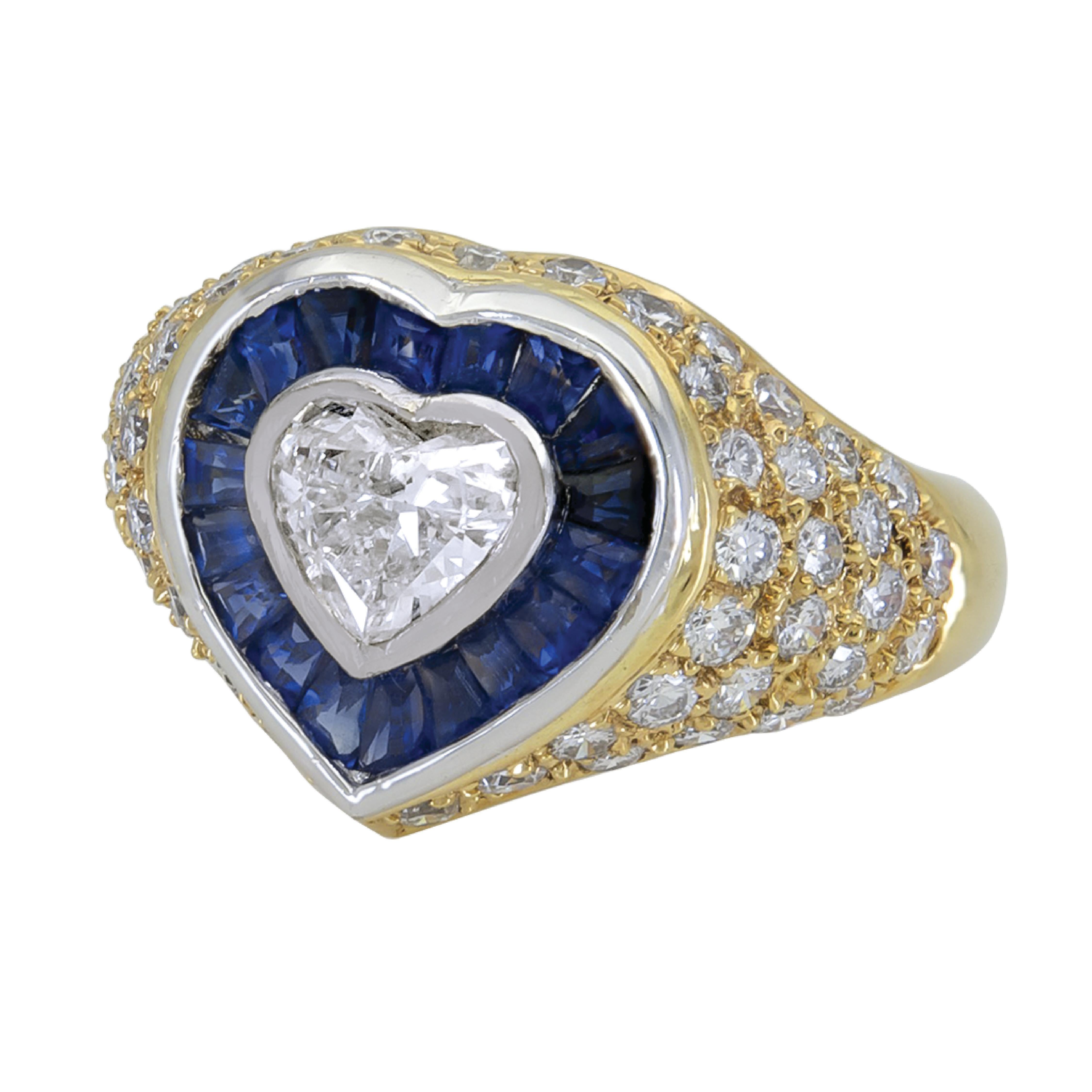 Art Deco inspired ring set in 18 karat yellow gold that features a 0.66 carat weight of center heart diamond accented with 0.90 carats of blue sapphires and 1.03 carats diamonds. 

Sophia D by Joseph Dardashti LTD has been known worldwide for 35