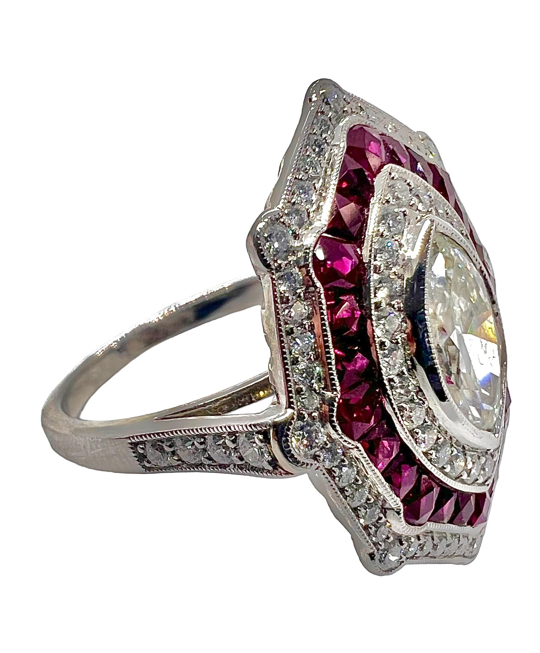 Platinum art deco ring with a marquise cut diamond center that weighs 1.01 carats surrounded with 0.51 carat diamonds and 1.10 carat rubies.

Sophia D by Joseph Dardashti LTD has been known worldwide for 35 years and are inspired by classic Art Deco