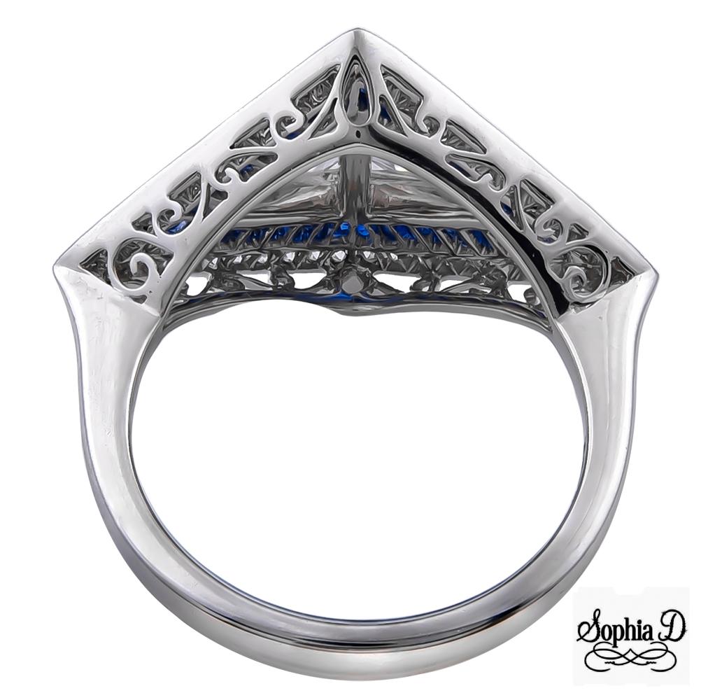 An art deco inspired ring set in platinum with 1.07 carat center trillion cut diamond accentuated with 0.27 carat small round diamond and 0.50 carat blue sapphire.

Sophia D by Joseph Dardashti LTD has been known worldwide for 35 years and are