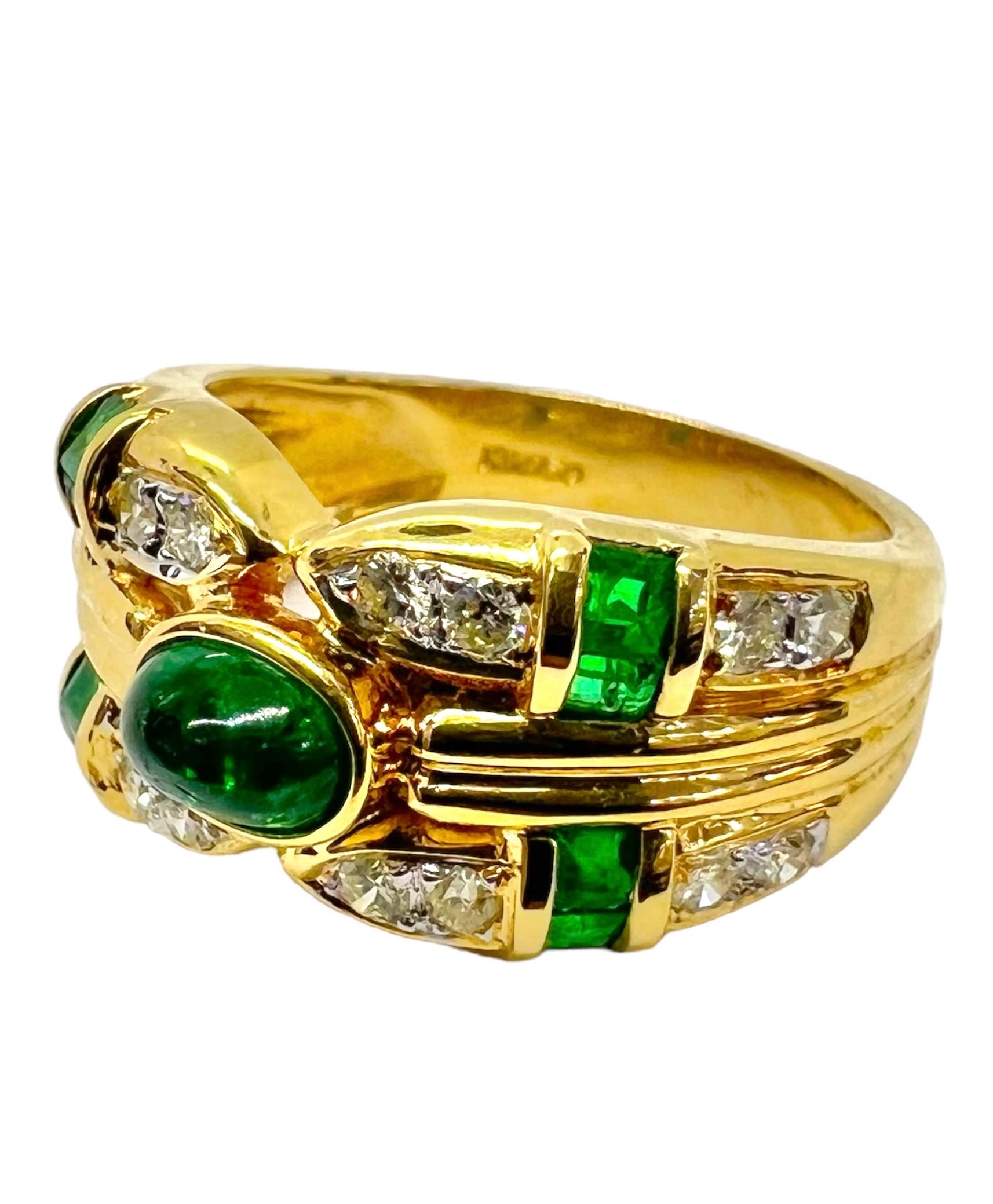 18K yellow gold cardinal ring with emerald center stone accentuated with diamonds and emeralds. 

Sophia D by Joseph Dardashti LTD has been known worldwide for 35 years and are inspired by classic Art Deco design that merges with modern