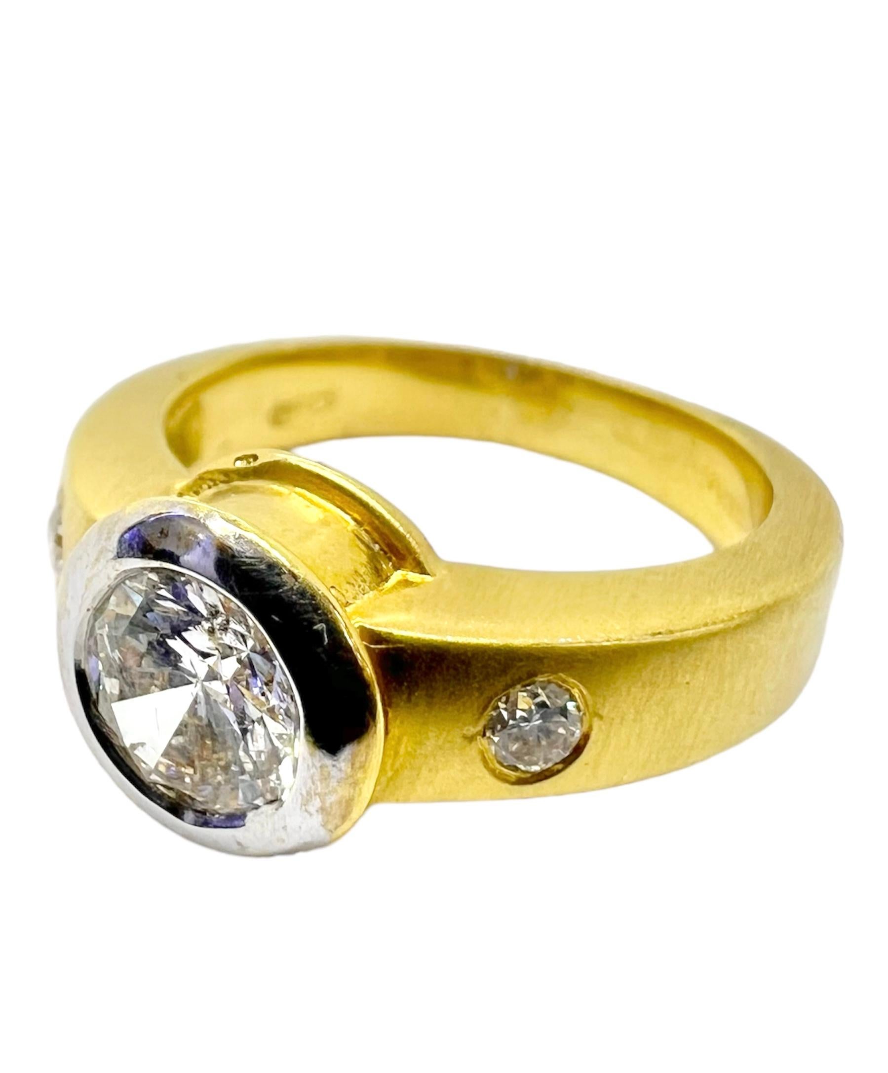 18K yellow gold with center round diamond with 2 small round diamonds.

Sophia D by Joseph Dardashti LTD has been known worldwide for 35 years and are inspired by classic Art Deco design that merges with modern manufacturing techniques.  