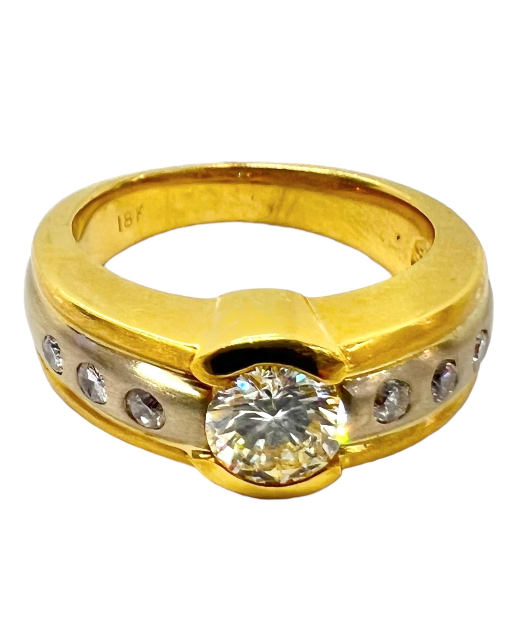 18K yellow gold and platinum round diamond with small round diamonds. 

Sophia D by Joseph Dardashti LTD has been known worldwide for 35 years and are inspired by classic Art Deco design that merges with modern manufacturing techniques.  