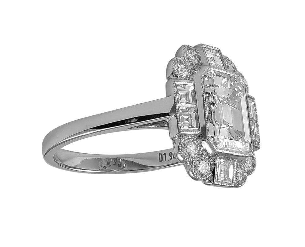 This Art Deco platinum ring has a center stone that weighs a total of 1.94 carat. Surrounded  and accentuated with square cut and round diamonds that is approximately 0.83 carats.

Sophia D by Joseph Dardashti LTD has been known worldwide for 35