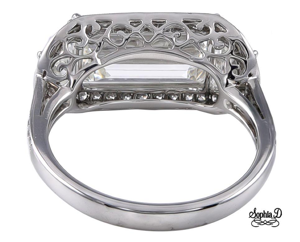 Sophia D Art Deco inspired platinum ring that features 2.01 carat of baguette diamond as a center stone flanked with 2 diamonds with a total weight of 0.50 carats and surrounded with 0.24 carats of round diamonds.

The ring available for