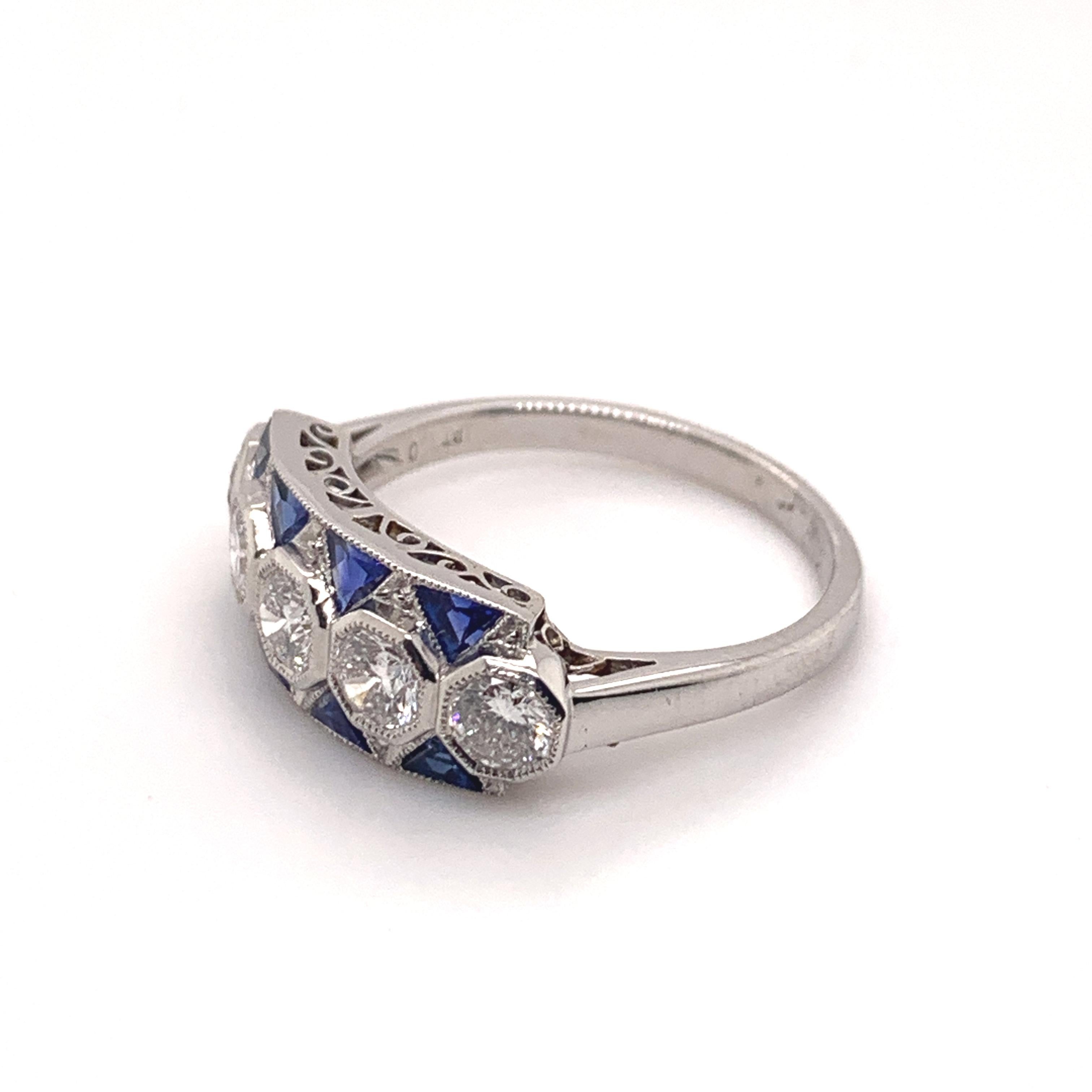 Sophia D. art deco ring set in platinum with 5 round diamonds with a total weight of 2.06 carats accentuated with 0.97 carats of blue sapphires.

Sophia D by Joseph Dardashti LTD has been known worldwide for 35 years and are inspired by classic Art