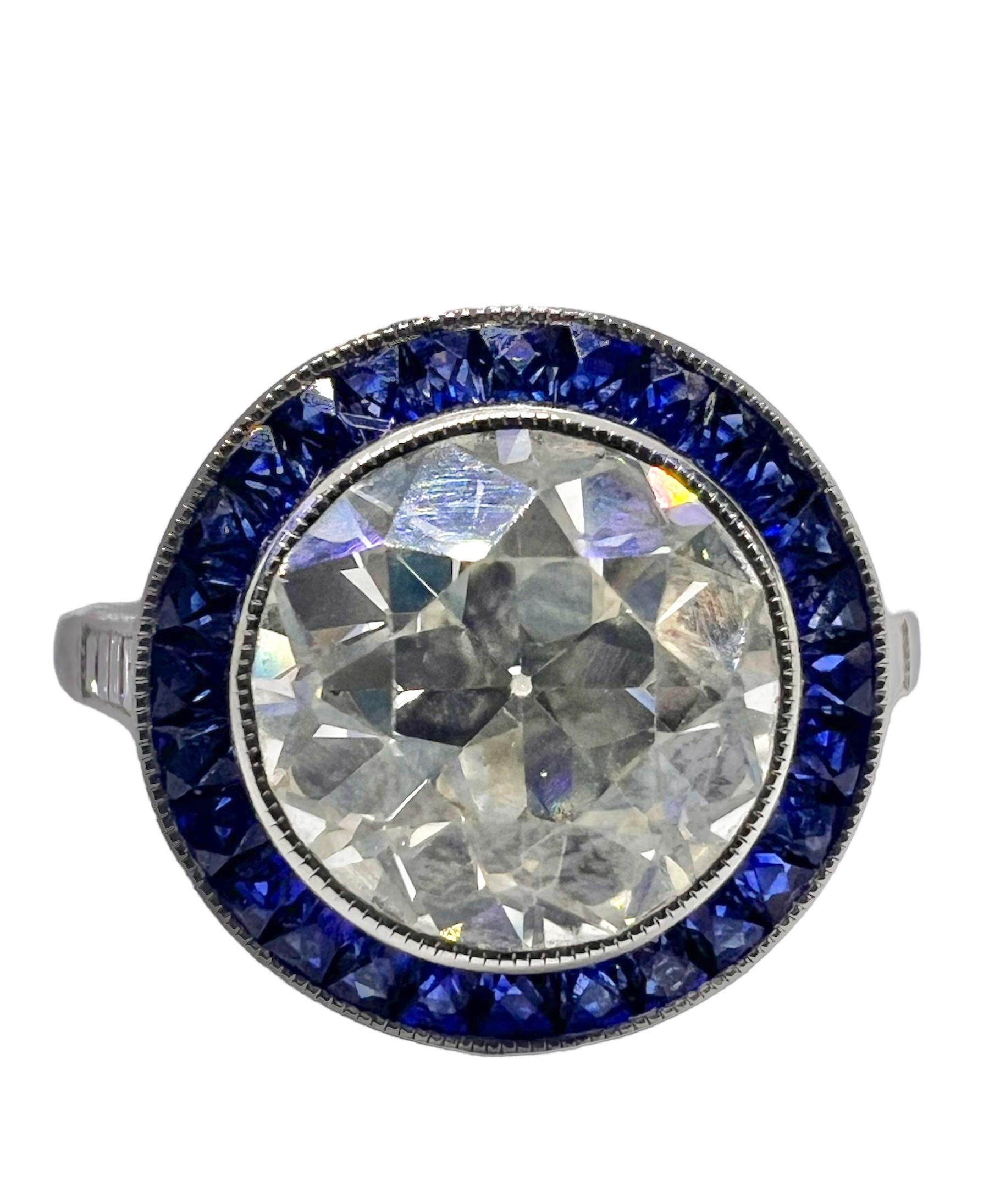 Sophia D. art deco ring in platinum setting with 2.07 carat center round diamond, 0.12 carat small diamonds and 0.50 carats blue sapphire.

Sophia D by Joseph Dardashti LTD has been known worldwide for 35 years and are inspired by classic Art Deco
