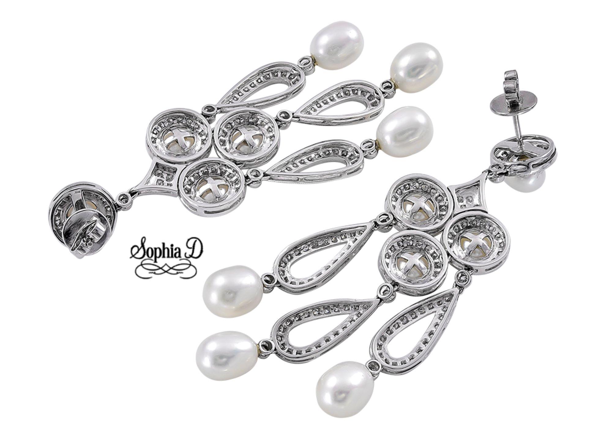 Sophia D. chandelier earrings featuring 3.13 carats of diamonds paired with lustrous pearls, all elegantly set in platinum. This exquisite design offers a perfect blend of glamour and sophistication, making it an ideal choice for any special
