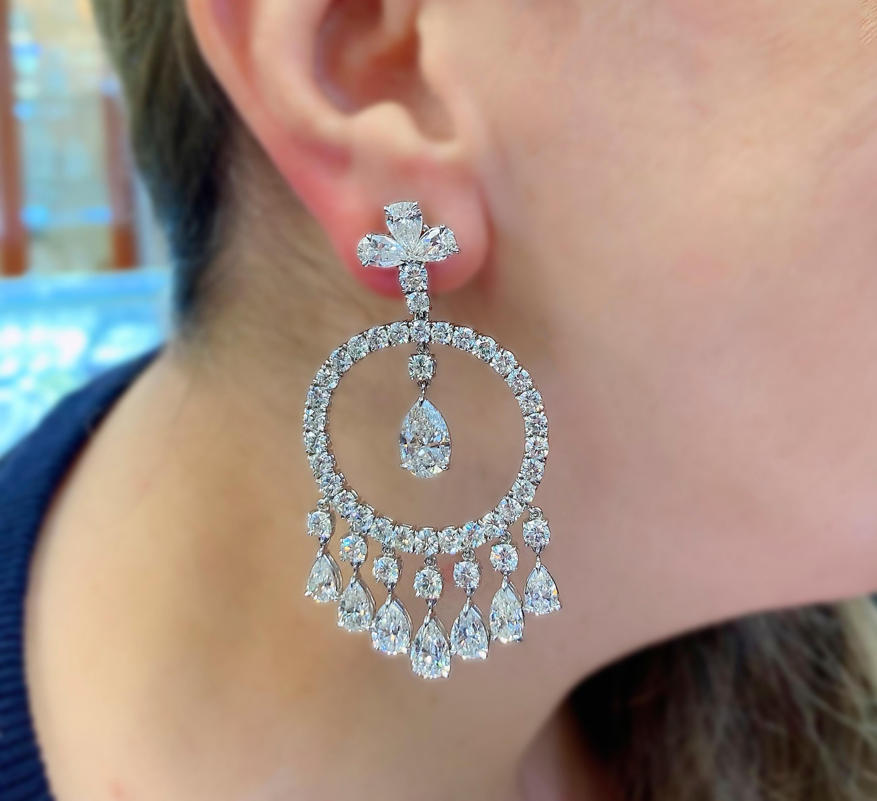 Sophia D 31.66 Carat Pear Shape Round Diamond Platinum Large Chandelier Earrings

These incredible earrings are a true statement by themselves. Round diamonds are set in the center in the circle with pear shape diamond drops underneath as well as in