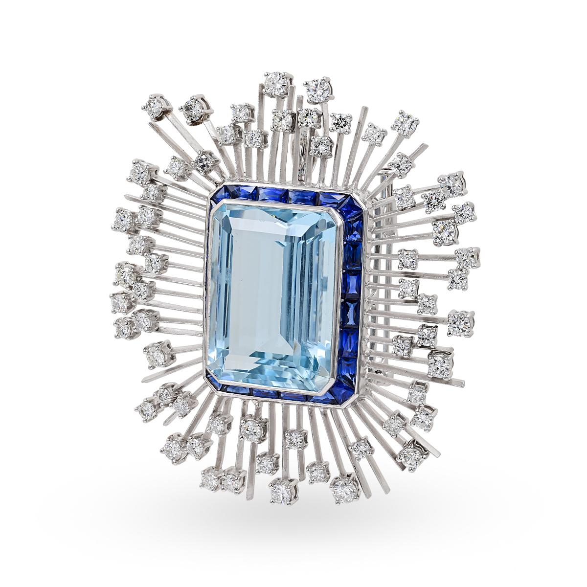 This brooch is designed with aquamarine stone in the center with the total carat weight of 35.03 accented with sapphire with the carat weight of 3.70 and diamonds with the total carat weight of 3.55. 

Sophia D by Joseph Dardashti LTD has been known