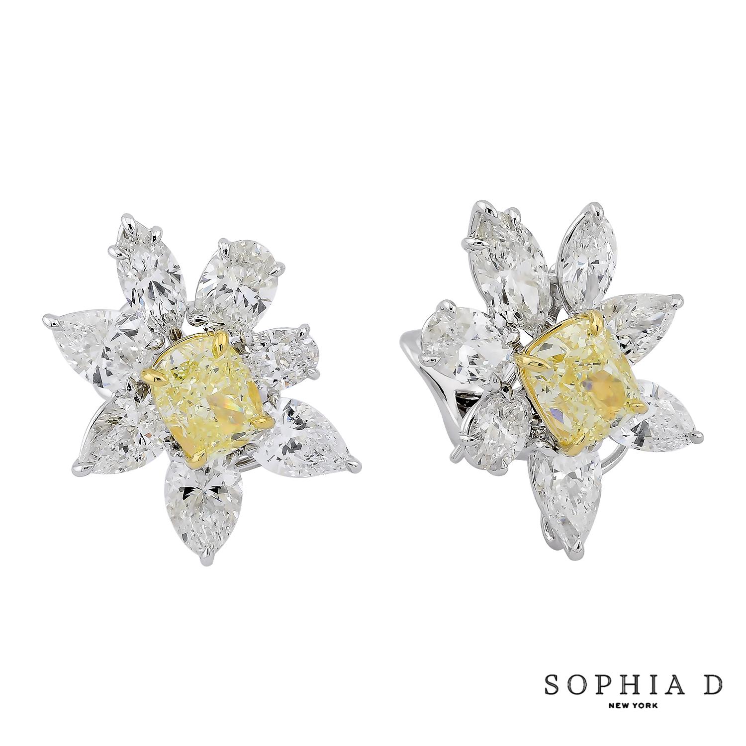 These striking cluster earrings combine the timeless elegance of platinum and 18K yellow gold with the brilliance of diamonds. Featuring 6.00 CT of yellow diamonds and 11.09 CT of white diamonds, the intricate design showcases a perfect balance of