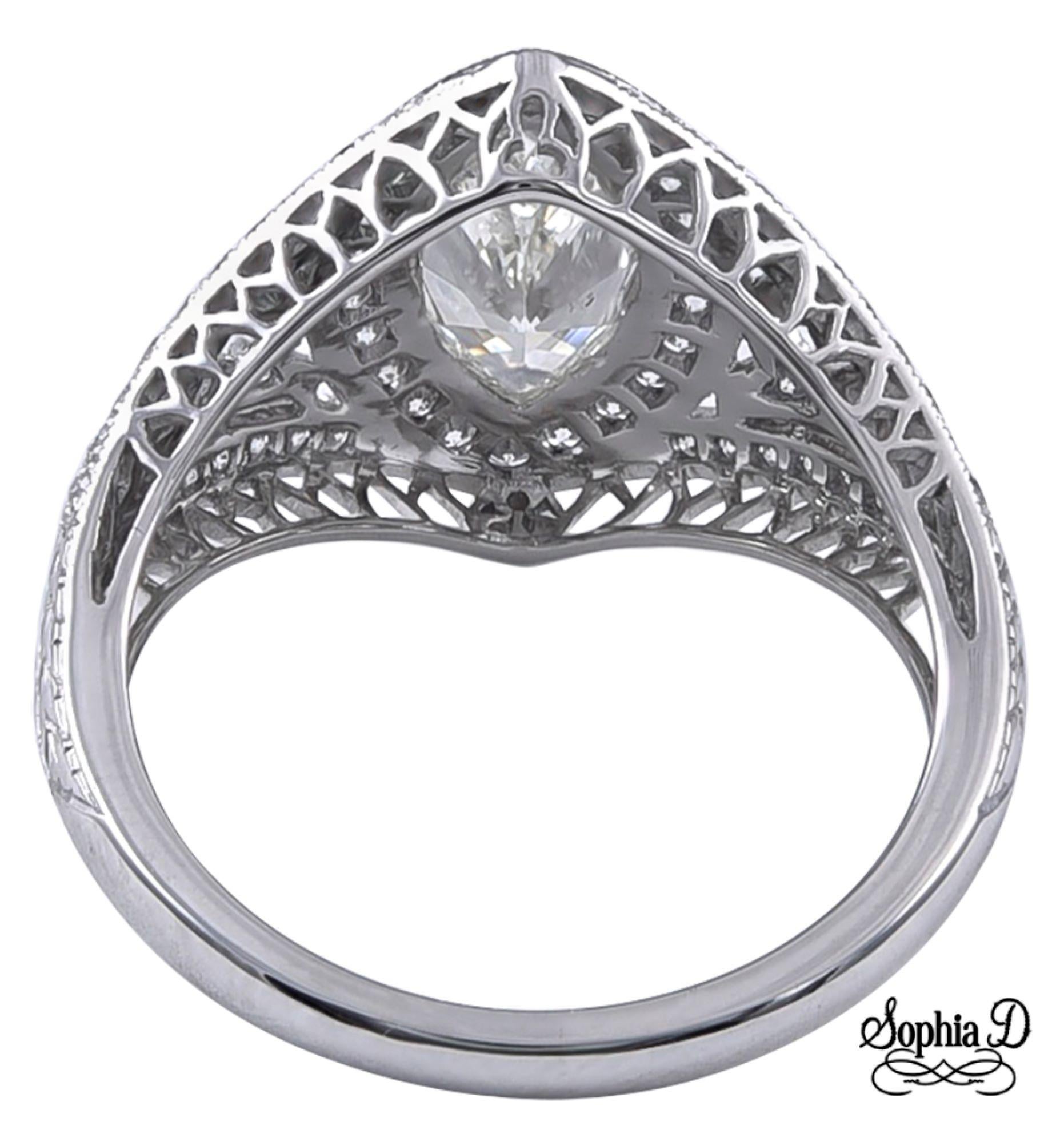 This stunning Art Deco ring features a .96-carat marquise cut center diamond, beautifully accented by .42 carats of additional diamonds. Crafted in platinum, the design showcases intricate detailing that embodies the elegance of the era. A perfect