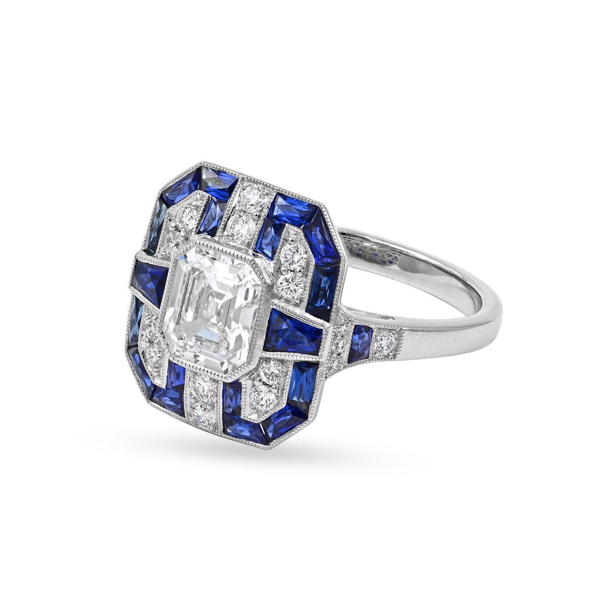 A one of a kind Sophia D art deco style ring featuring an Ascher cut diamond with a total weight of 1.03 carats surrounded with trapezoid cut and French cut blue sapphires with a total weight of 1.09 carats and round diamonds with a total weight of