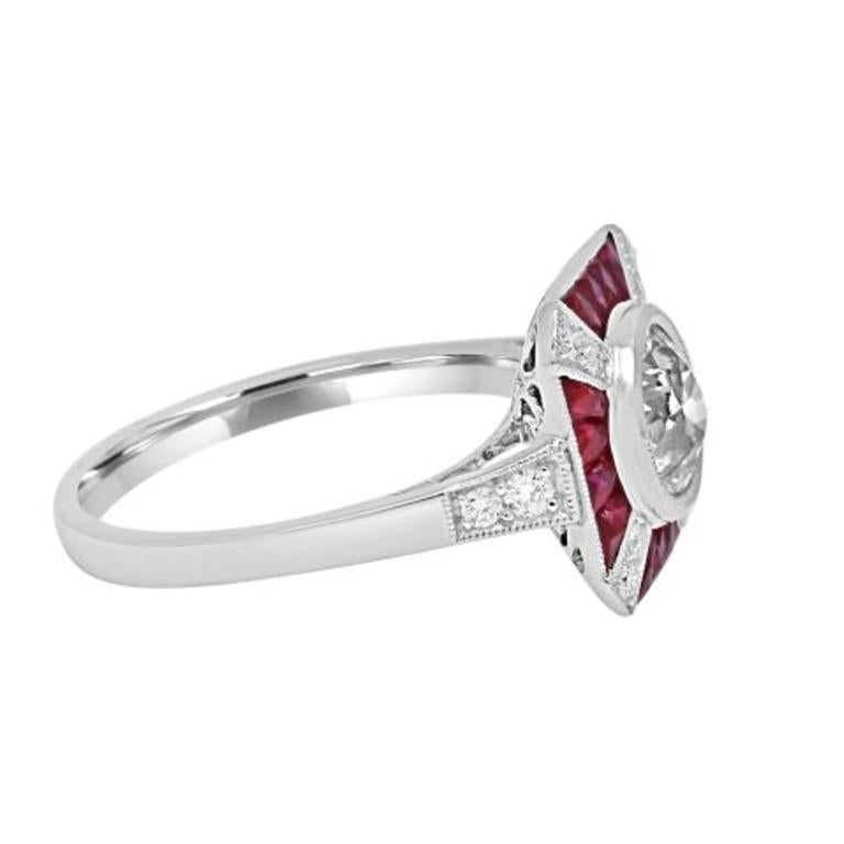 Art deco inspired platinum ring created by Sophia D, this ring features a 1.07 carat center round diamond with ruby stones with the total carat weight of 0.75 carats and small diamonds weighing 0.16 carats.

Sophia D by Joseph Dardashti LTD has been